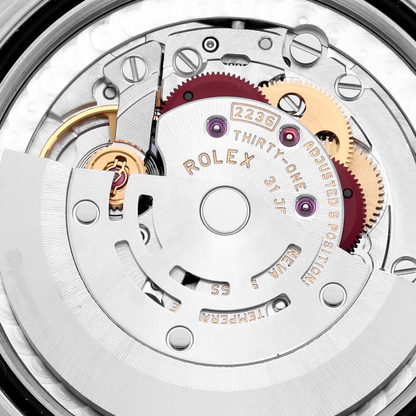 The image shows a close-up view of the Rolex Mid-Size 278274 Women's Stainless Steel White Dial 278274 Women's Stainless Steel White Dial watch movement, highlighting gears and mechanical parts.