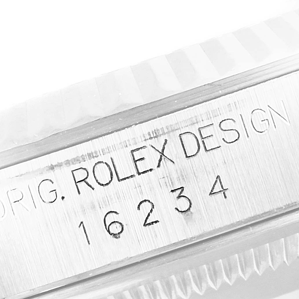 The image shows a close-up of the case engraving on a Rolex Datejust 16234 Men
s Stainless Steel Silver Dial 16234 Men
s Stainless Steel Silver Dial model, including the model number "16234" and "Rolex Design."