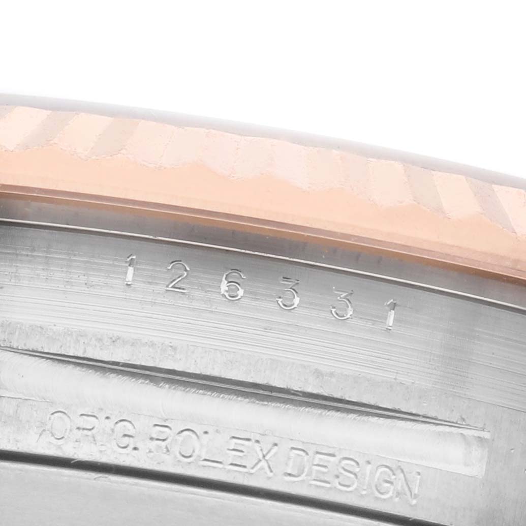The image shows the side of the Rolex Datejust 41 126331 Men's Steel and Gold (two tone) Grey Dial, focusing on the engraved model number and "ORIG. ROLEX DESIGN."
