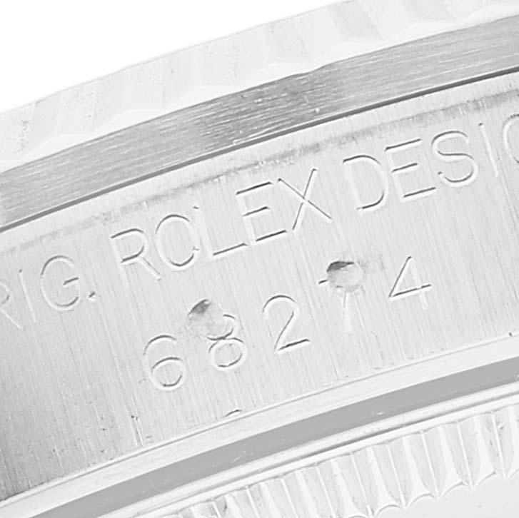 This close-up image shows the engraved side of the case for a Mid-Size Rolex watch.