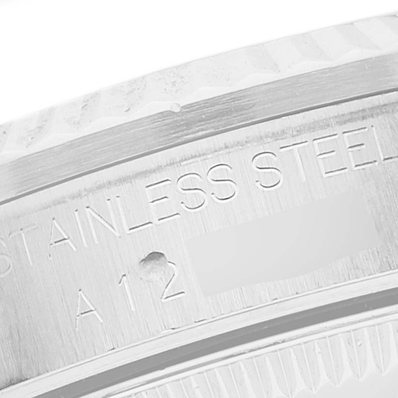 Close-up of the stainless steel case back of a Rolex Mid-Size 68274 Women
s Stainless Steel Silver Dial 68274 Women
s Stainless Steel Silver Dial watch, showing part of the engraved text.