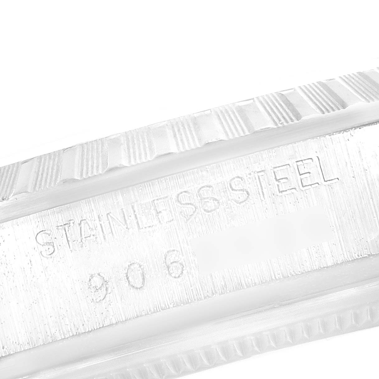 This image shows a close-up of the bezel and the engraved “STAINLESS STEEL” on the side of a Rolex Datejust 16030 Men's Stainless Steel Silver Dial 16030 Men's Stainless Steel Silver Dial watch.