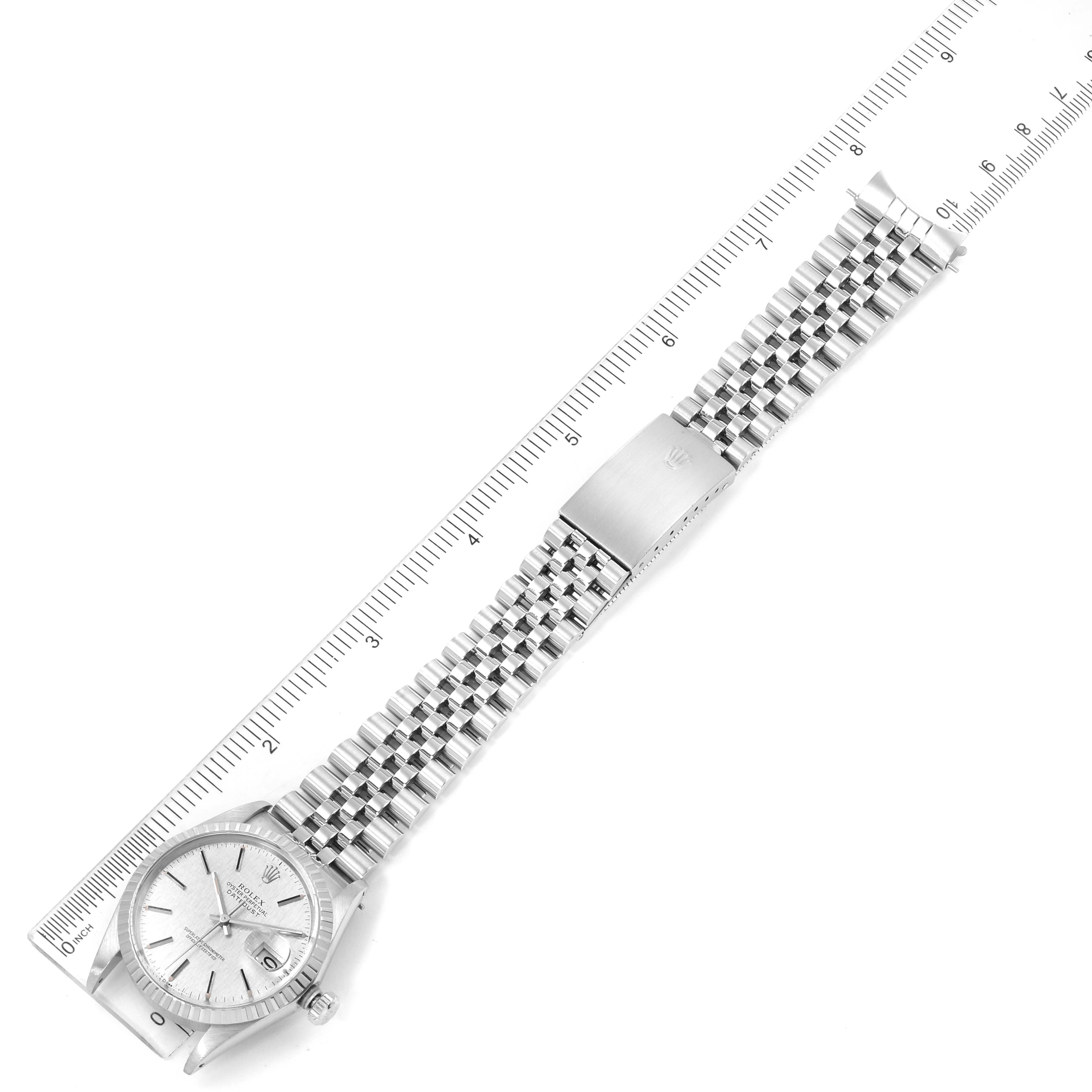 The image shows a top-down view of a Rolex Datejust 16030 Men's Stainless Steel Silver Dial 16030 Men's Stainless Steel Silver Dial watch, highlighting its face, bracelet, and clasp.