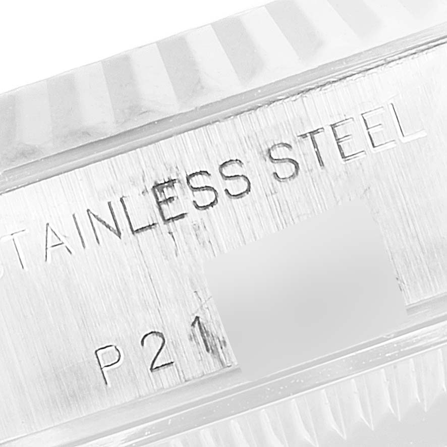 The image shows a close-up of the case side of the Rolex Datejust 79174 Women's Stainless Steel Silver Dial 79174 Women's Stainless Steel Silver Dial watch with "STAINLESS STEEL" engraved.