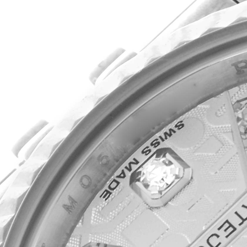 The image shows a close-up of the bezel and part of the dial of a Rolex Datejust 179174 Women
s Stainless Steel Silver Dial 179174 Women
s Stainless Steel Silver Dial watch.