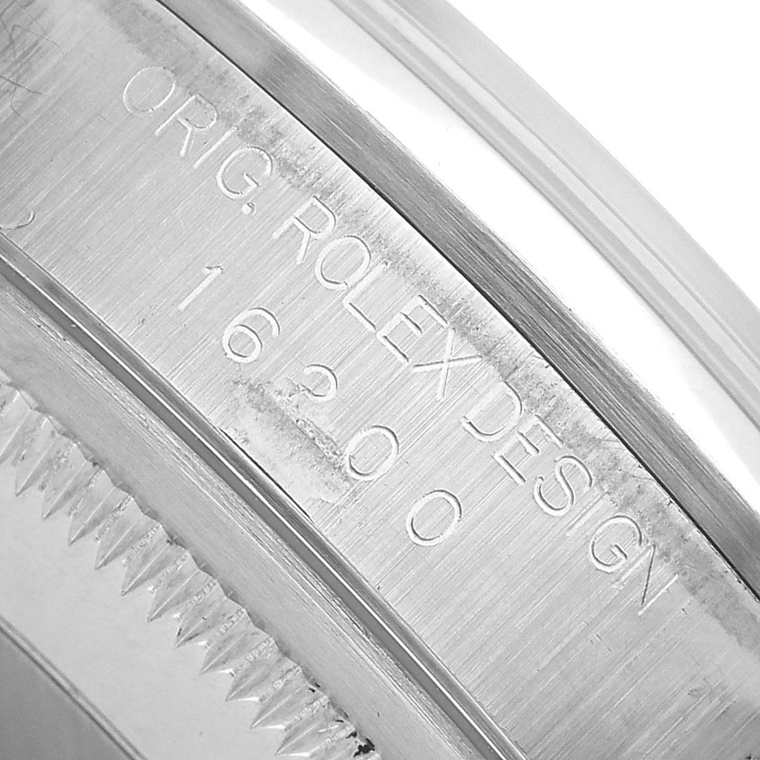 The image shows a close-up of the Rolex Datejust 16200 Men's Stainless Steel White Dial's engraved inner bezel, highlighting the model number.
