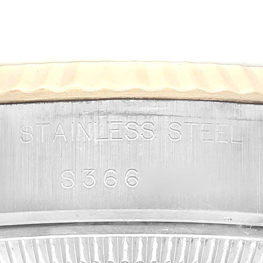 This image shows a close-up of the side of a Rolex Datejust 69173 Women's Steel and Gold (two tone) Champagne Dial 69173 Women's Steel and Gold (two tone) Champagne Dial watch, specifically the stainless steel part of the case.