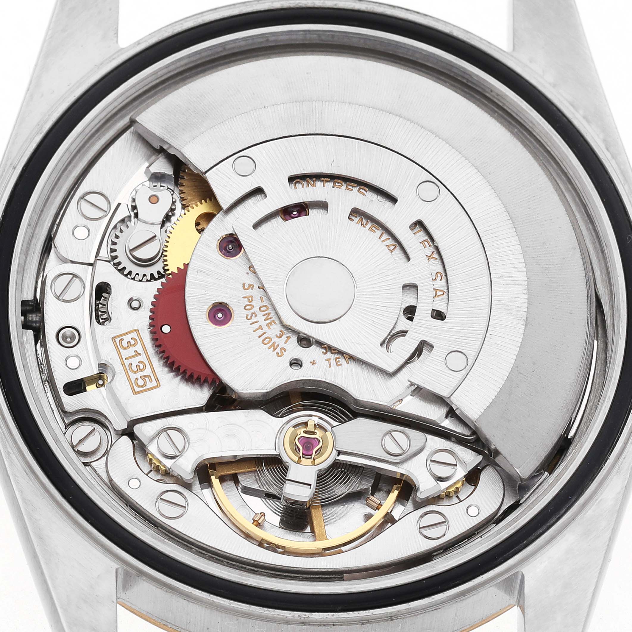 The image shows the movement of a Rolex Datejust 16233 Men's Steel and Gold (two tone) Champagne Dial watch from a top-down angle, highlighting the rotor and intricate gears.