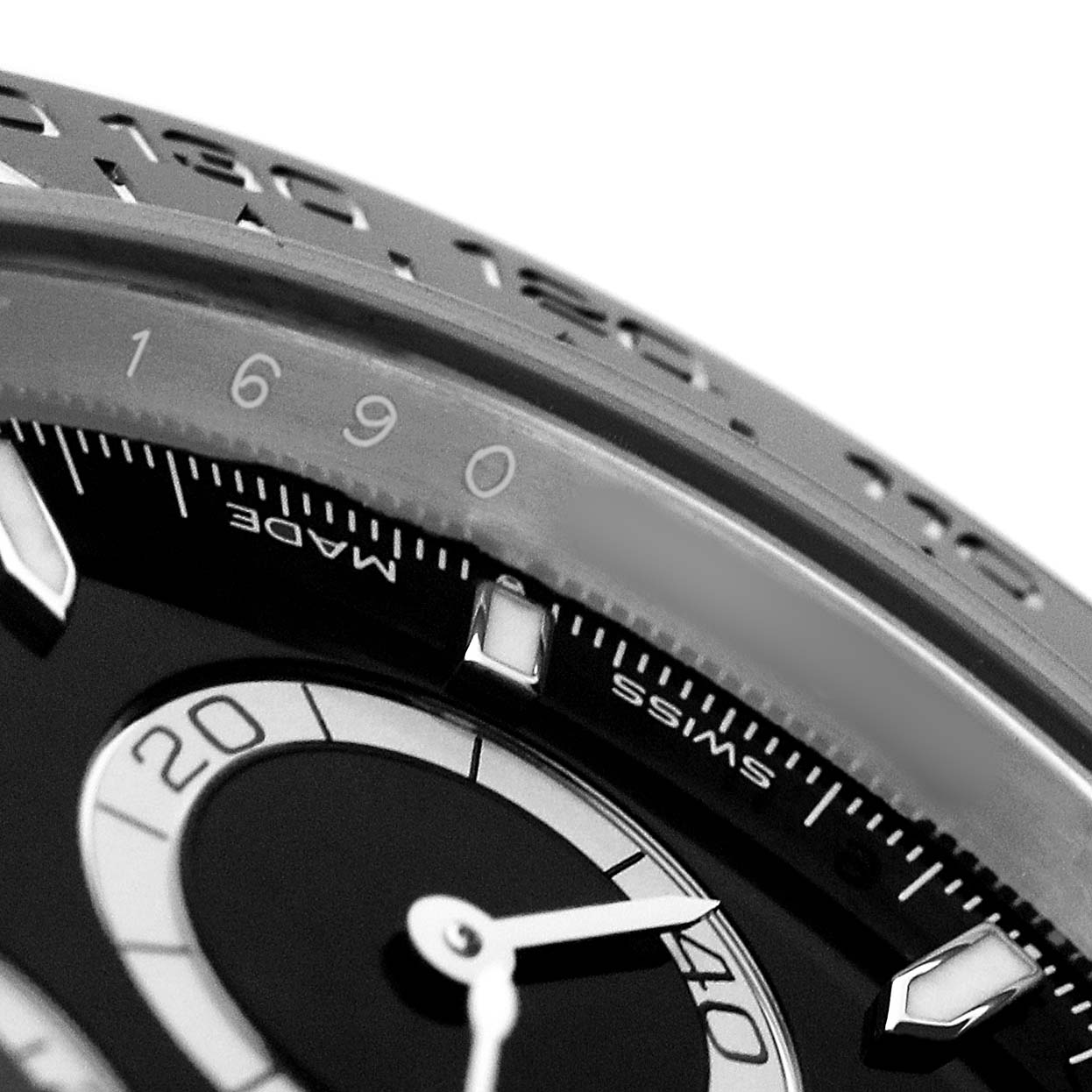 The image shows a close-up of the dial and bezel of a Rolex Daytona 126500 Men's Stainless Steel Black Dial watch, highlighting the tachymetric scale and subdial.