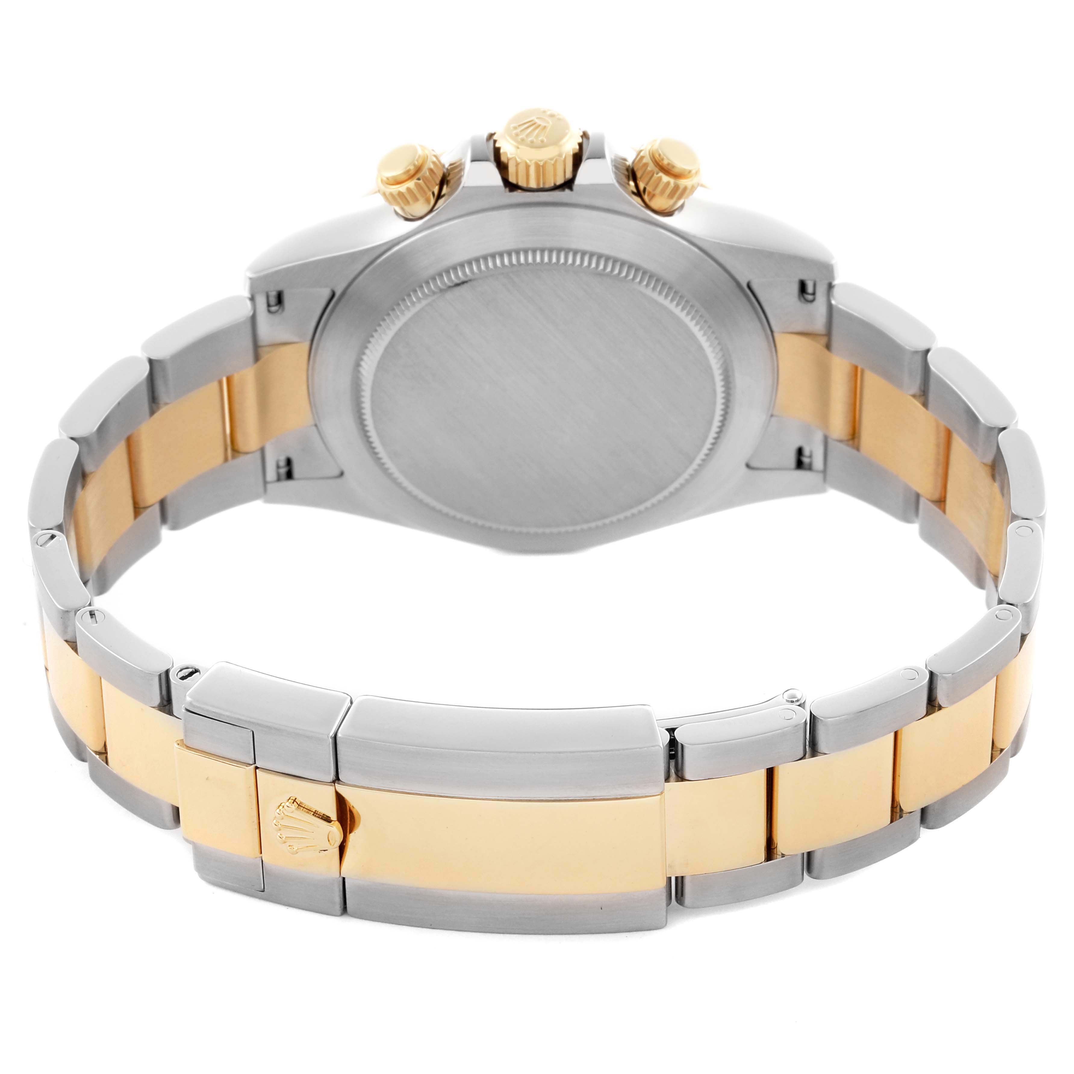 The image shows a Rolex Daytona 116503-0004 Men's Steel and Gold (two tone) Black Dial 116503-0004 Men's Steel and Gold (two tone) Black Dial watch from the back, highlighting the two-tone bracelet and the watch case.