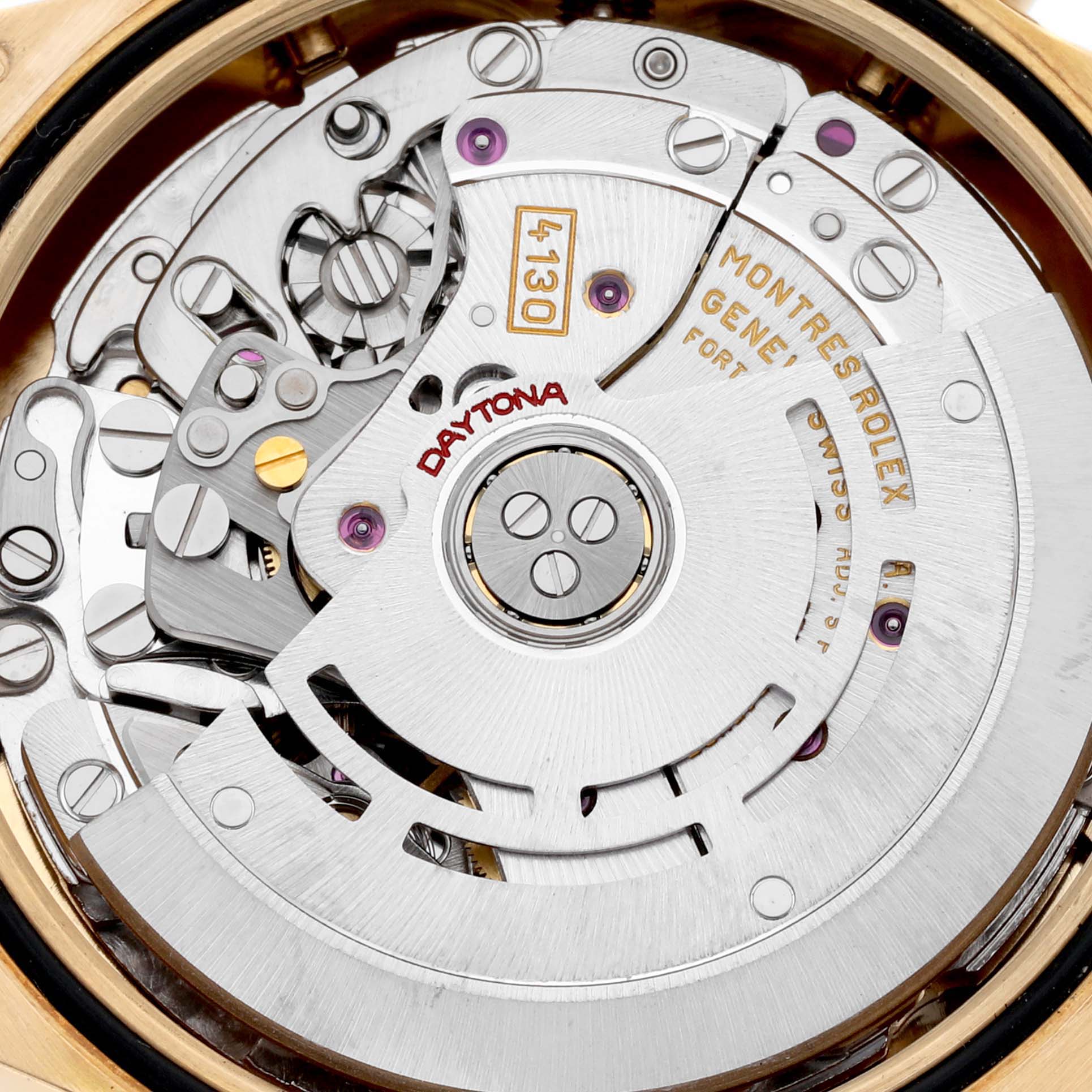 The image shows a close-up of the movement inside a Rolex Daytona 116528 Men's Yellow Gold White Dial 116528 Men's Yellow Gold White Dial, highlighting its intricate mechanical components.