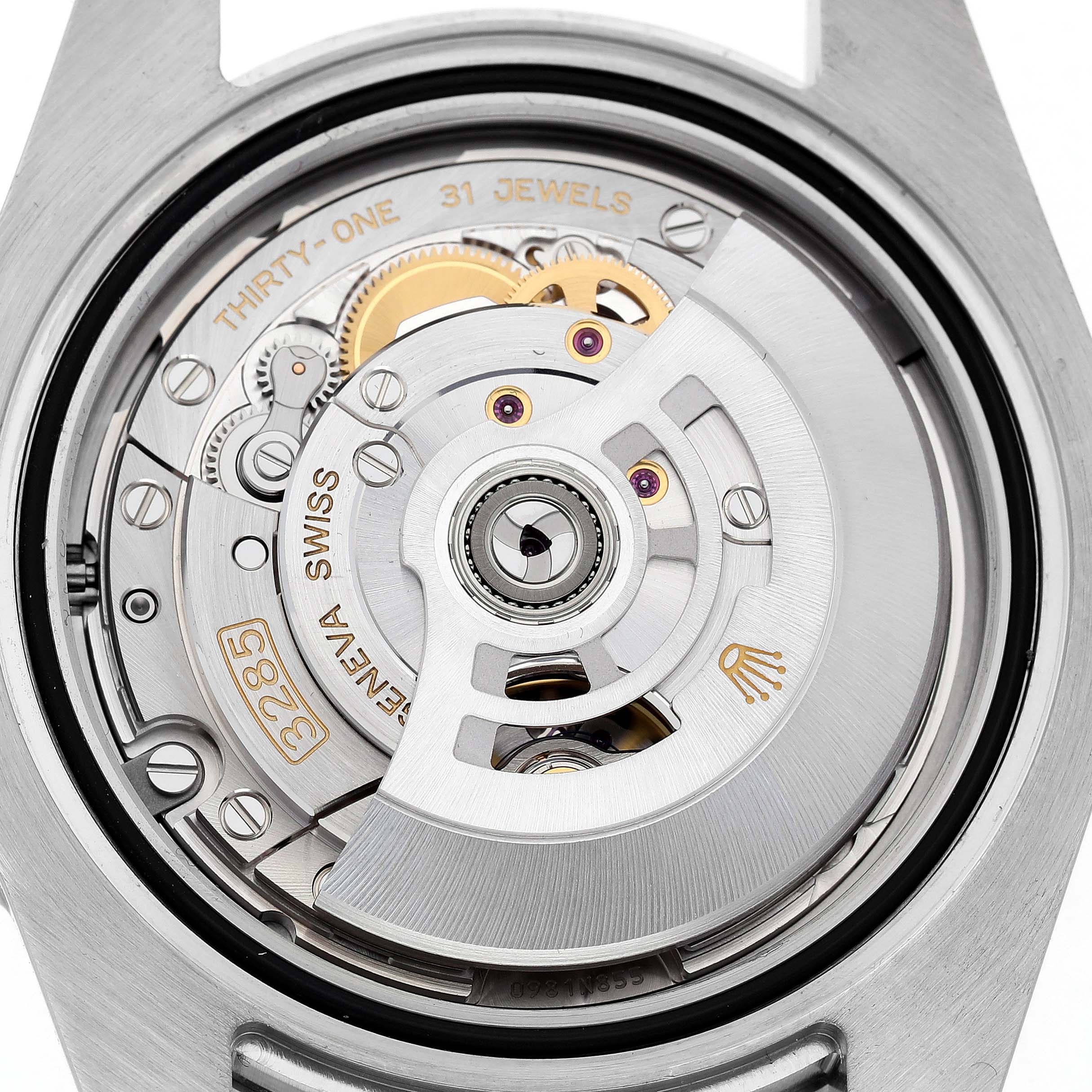 The image shows the movement of a Rolex GMT-Master 126710 Men's Stainless Steel Black Dial watch from a back view, highlighting the intricate mechanics and rotor.