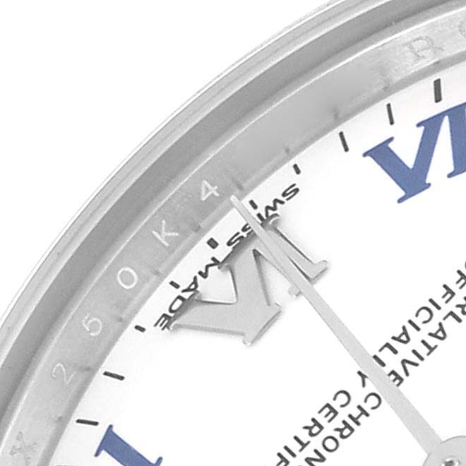 This is a close-up of a Rolex Mid-Size 177200 Women
s Stainless Steel White Dial 177200 Women
s Stainless Steel White Dial watch showing the dial with part of the Roman numerals, markers, and hour hand.