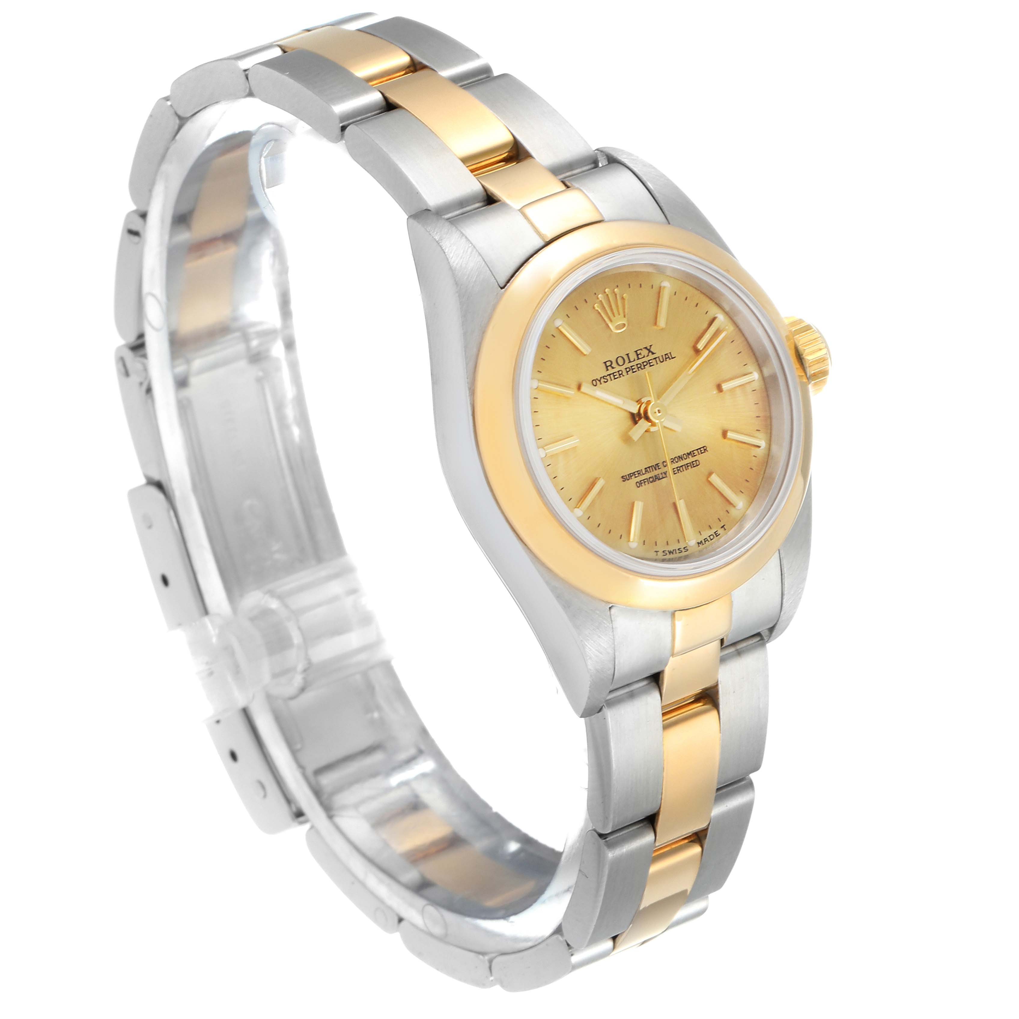 The image shows a side angle of a Rolex Oyster Perpetual 67183 Women's Steel and Gold (two tone) Champagne Dial 67183 Women's Steel and Gold (two tone) Champagne Dial watch highlighting its gold and silver bracelet and dial.