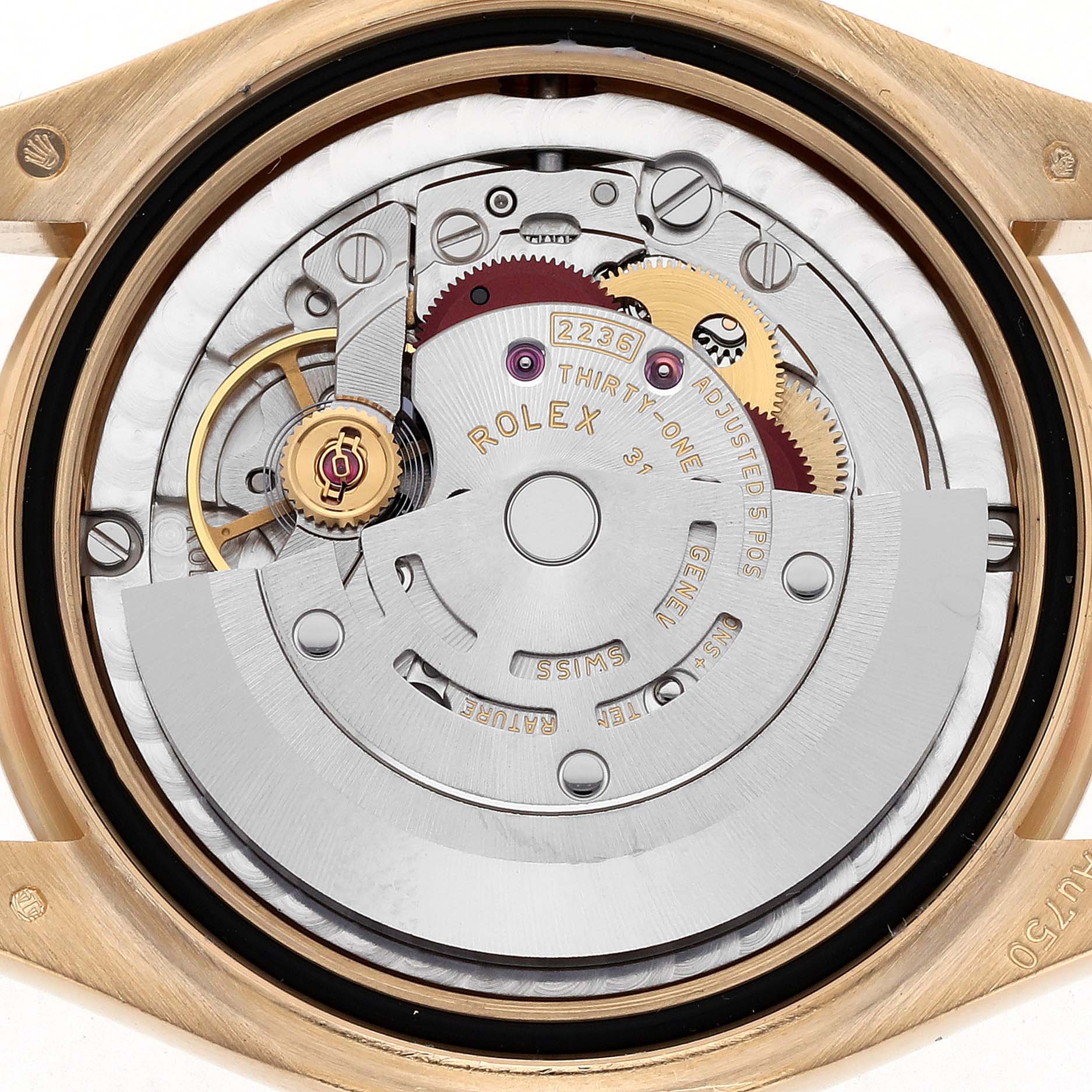 The image shows a close-up of the Rolex President 278278 Women
s Yellow Gold Champagne Dial 278278 Women
s Yellow Gold Champagne Dial model
s movement from the back, highlighting gears and inscriptions.