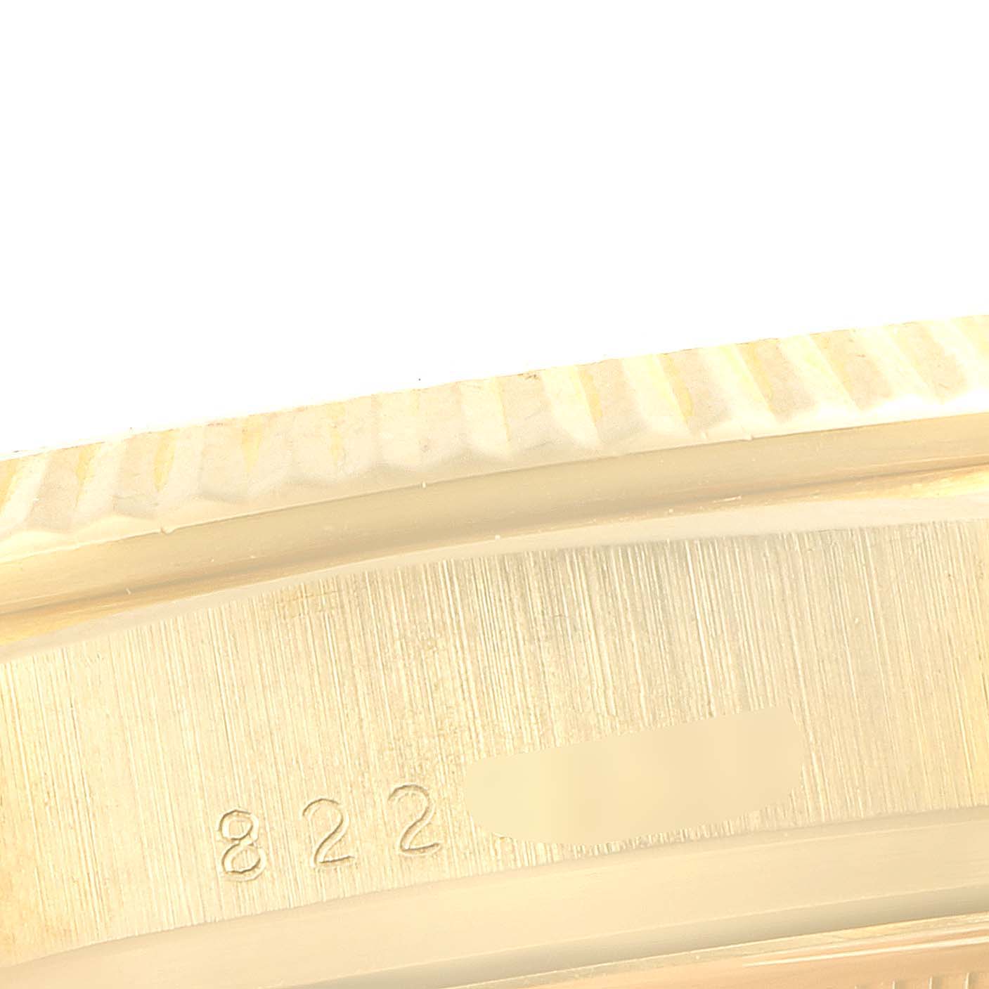 This image shows a close-up of the side of a Rolex President 18038 Men's Yellow Gold Champagne Dial 18038 Men's Yellow Gold Champagne Dial model watch case, highlighting the engraved reference numbers.