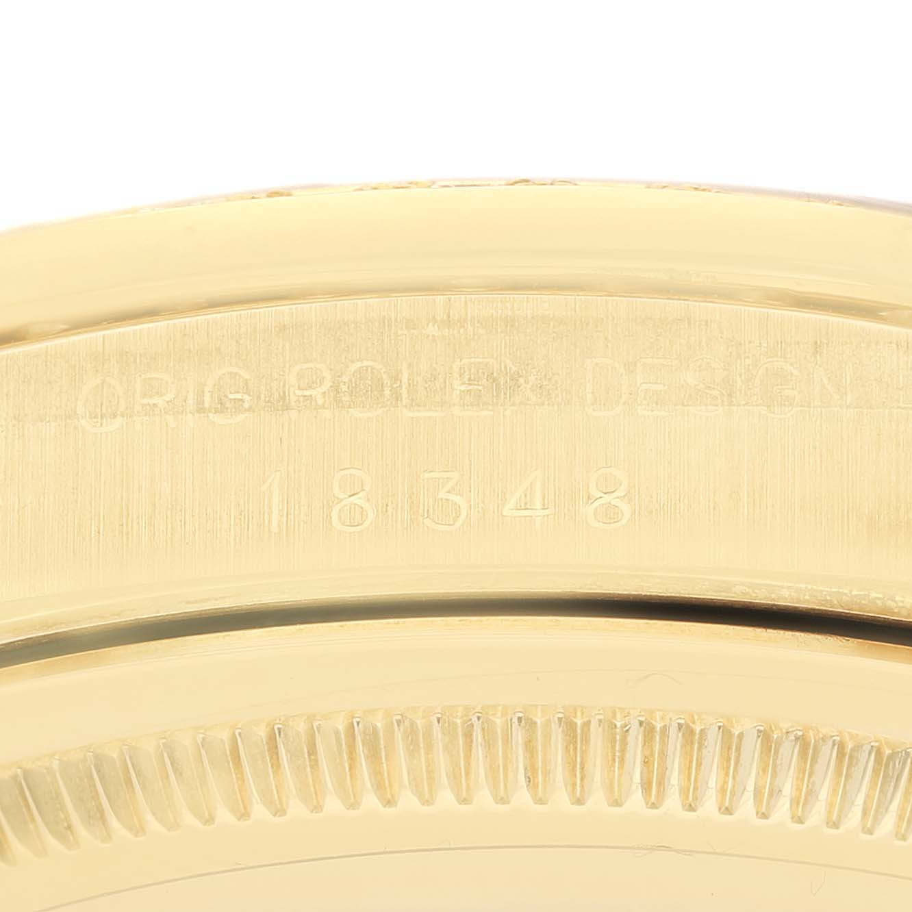 The image shows a close-up of the engraved case side of a Rolex President 18348 Men's Yellow Gold Champagne Dial watch, displaying its design and model number.