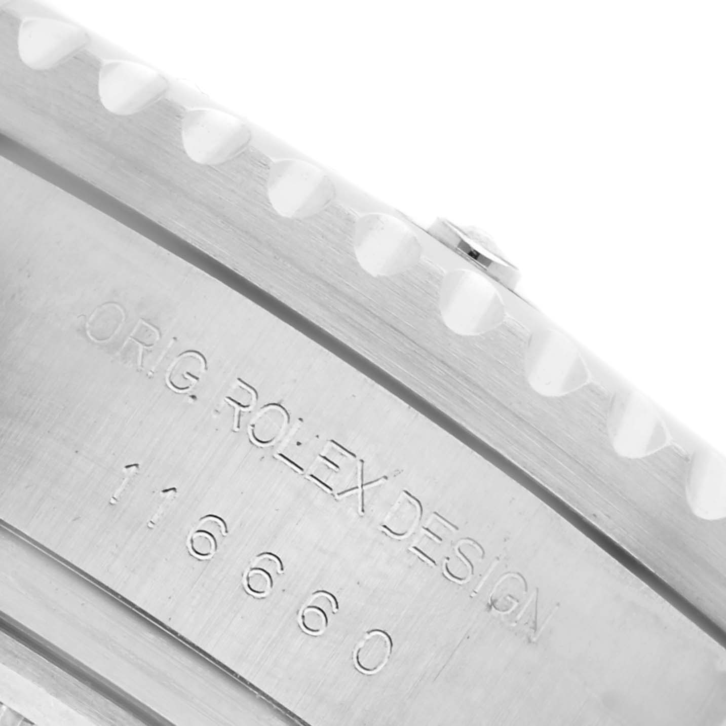 This image shows a close-up of the side of a Rolex Sea-Dweller 116660 Men's Stainless Steel Black Dial 116660 Men's Stainless Steel Black Dial, focusing on the engraved text and bezel edge.
