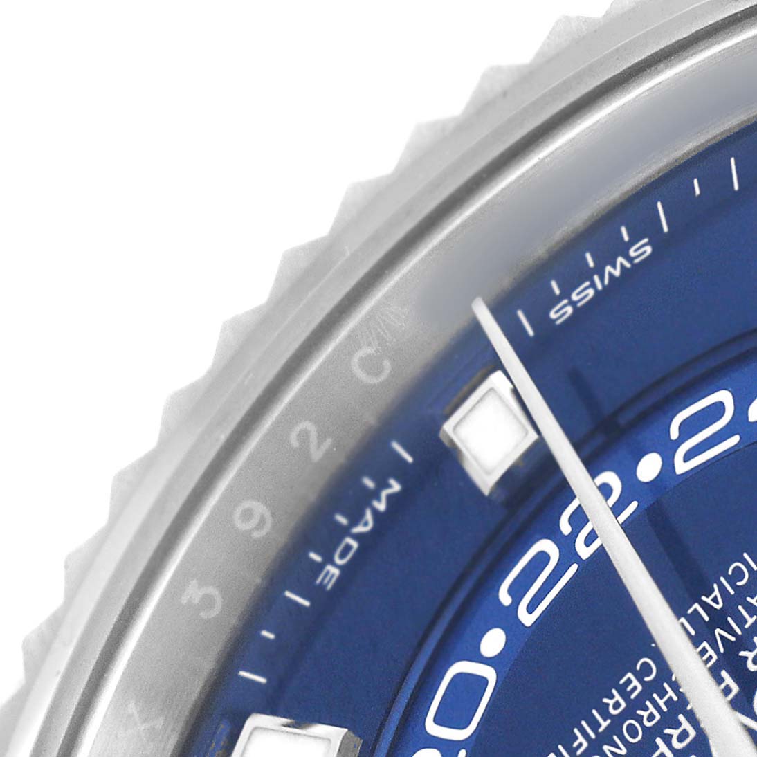 The image shows a close-up of the dial and bezel of a Rolex Sky-Dweller 326934 Men's Stainless Steel Blue Dial, highlighting the hands and a portion of the numbers.