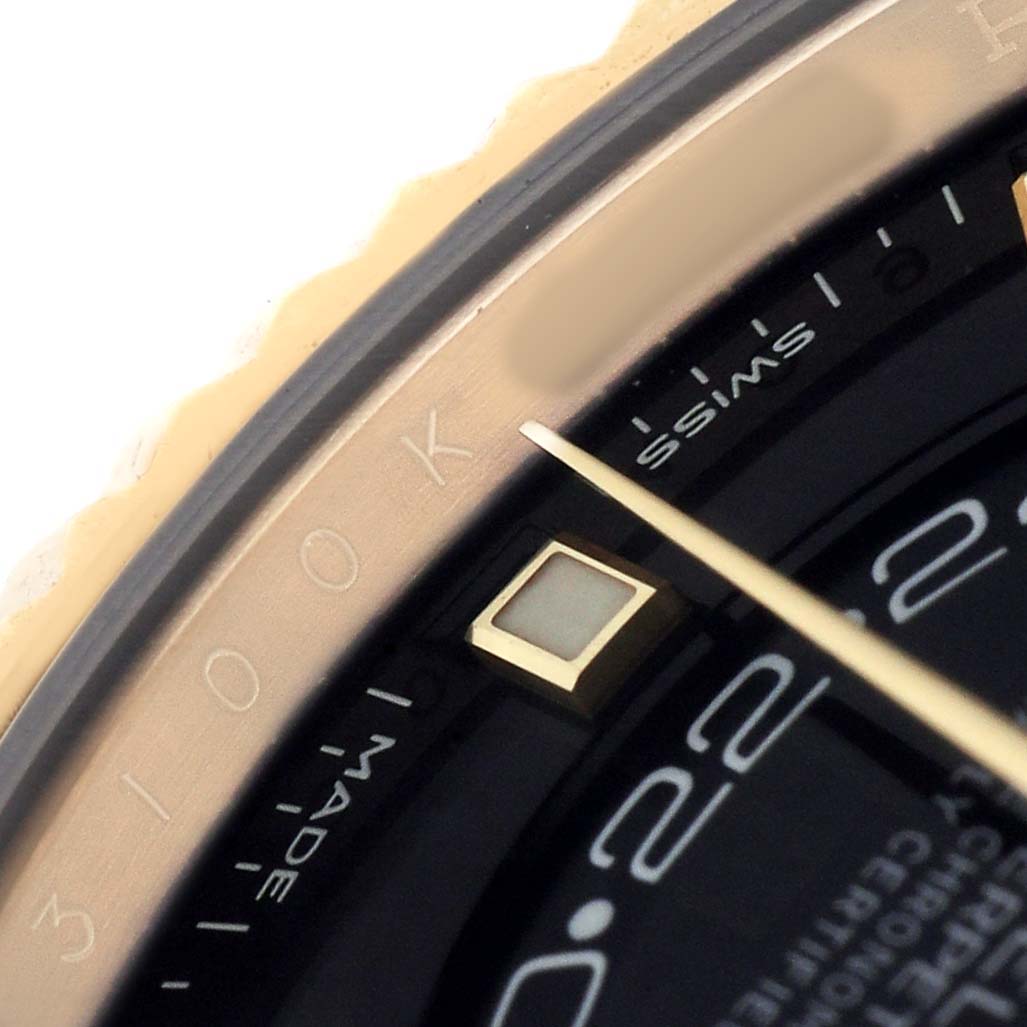 The image shows a close-up of the Rolex Sky-Dweller 326238 Men's Yellow Gold Black Dial watch's dial and bezel, highlighting part of the numbering and indicators.
