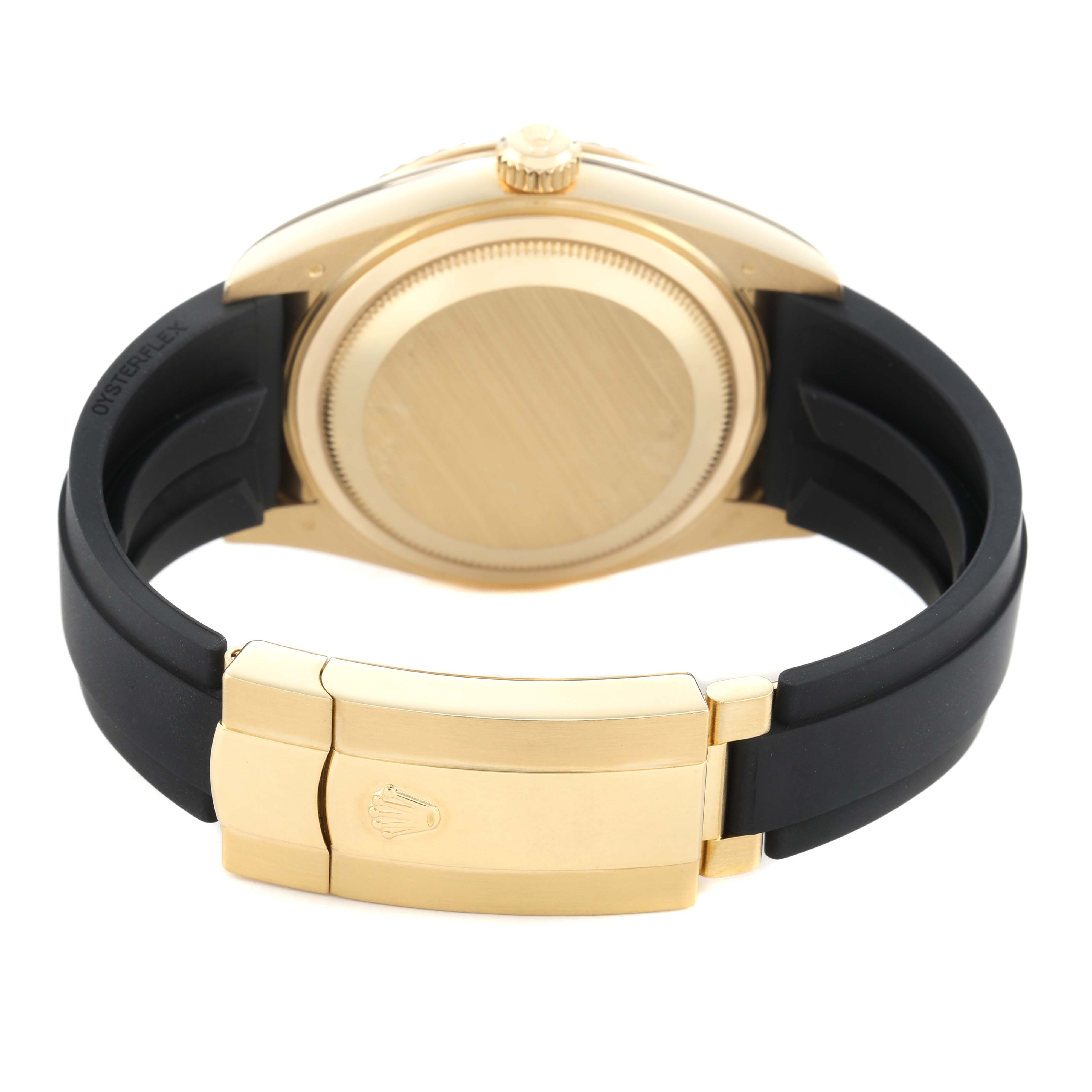 The image shows the back of a Rolex Sky-Dweller 326238 Men's Yellow Gold Black Dial watch, focusing on the case back, crown, and clasp with the strap.