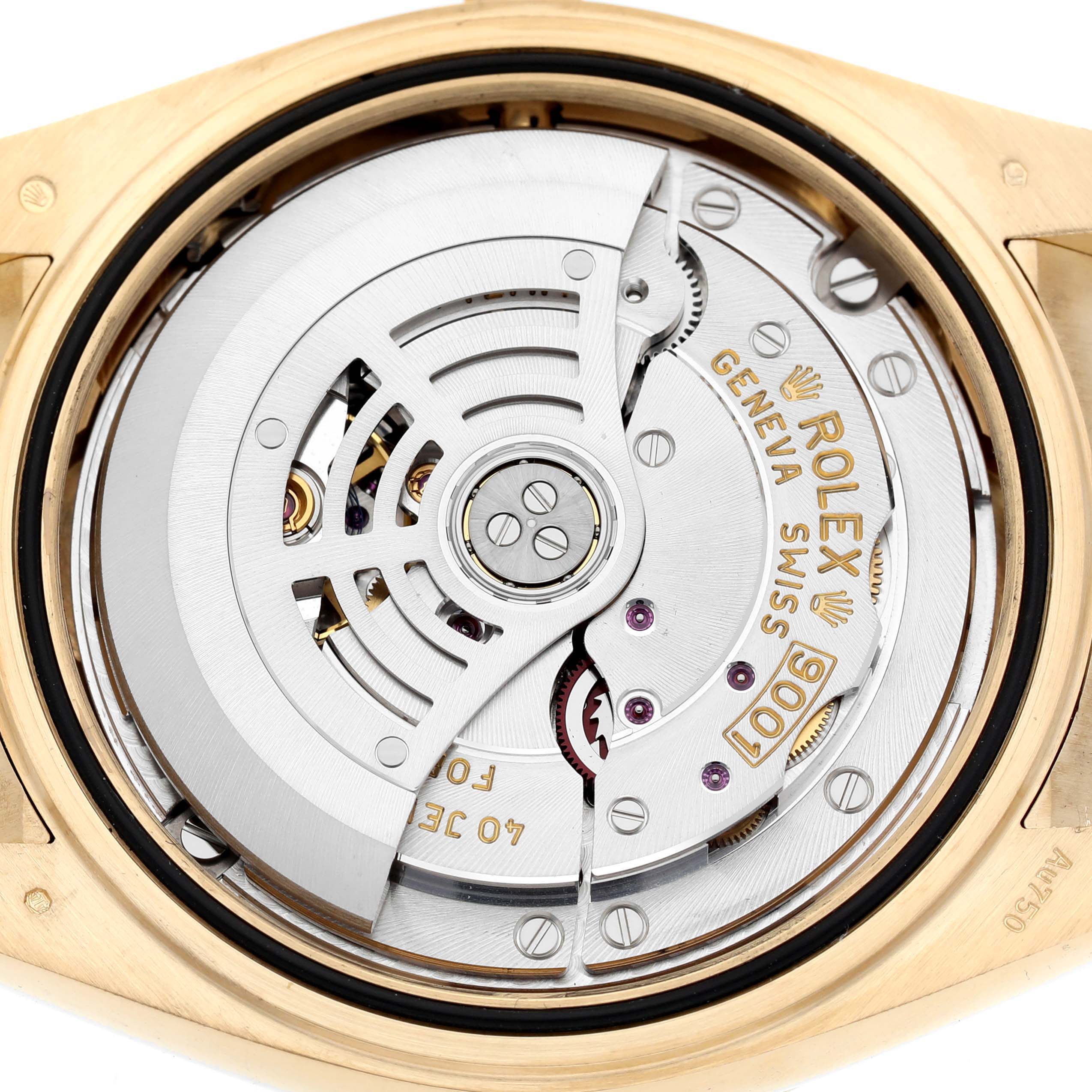 The image shows the back view of a Rolex Sky-Dweller 326238 Men's Yellow Gold Champagne Dial, focusing on its intricate movement and rotor.