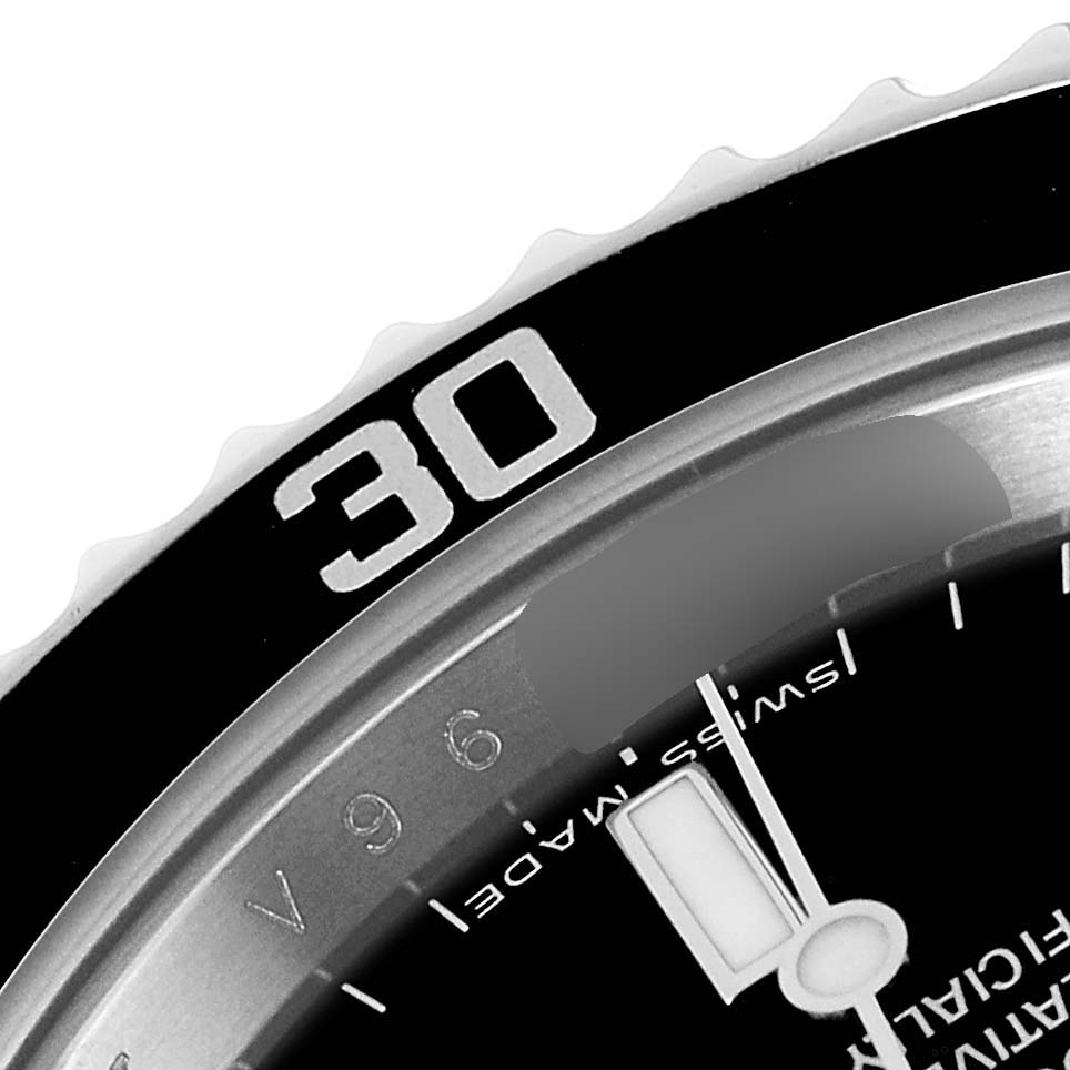 The image shows a close-up angle of the bezel and part of the dial of a Rolex Submariner 14060M Men
s Stainless Steel Black Dial 14060M Men
s Stainless Steel Black Dial watch.