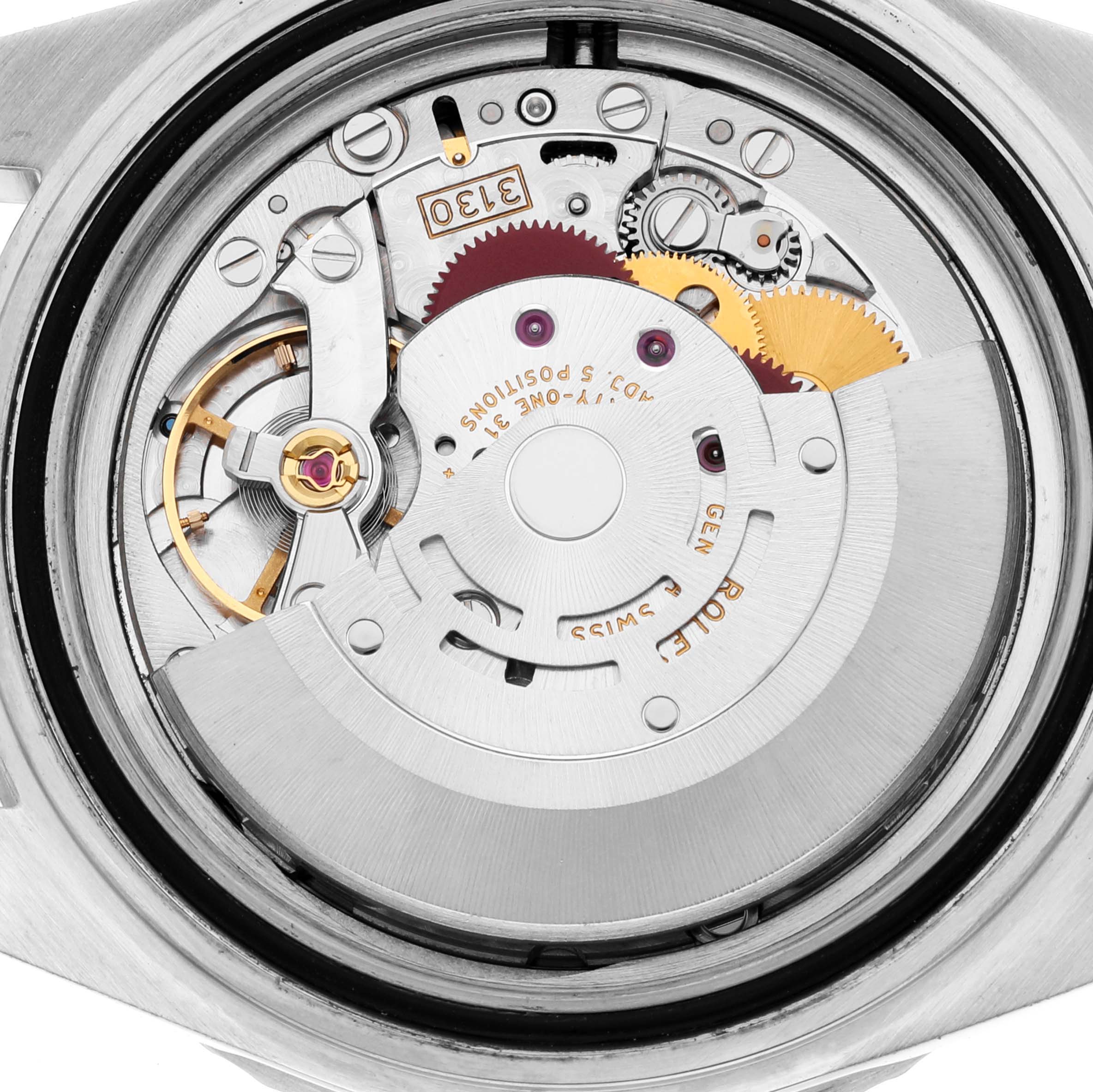 This image shows a close-up view of the Rolex Submariner 14060M Men
s Stainless Steel Black Dial 14060M Men
s Stainless Steel Black Dial
s internal watch movement components.