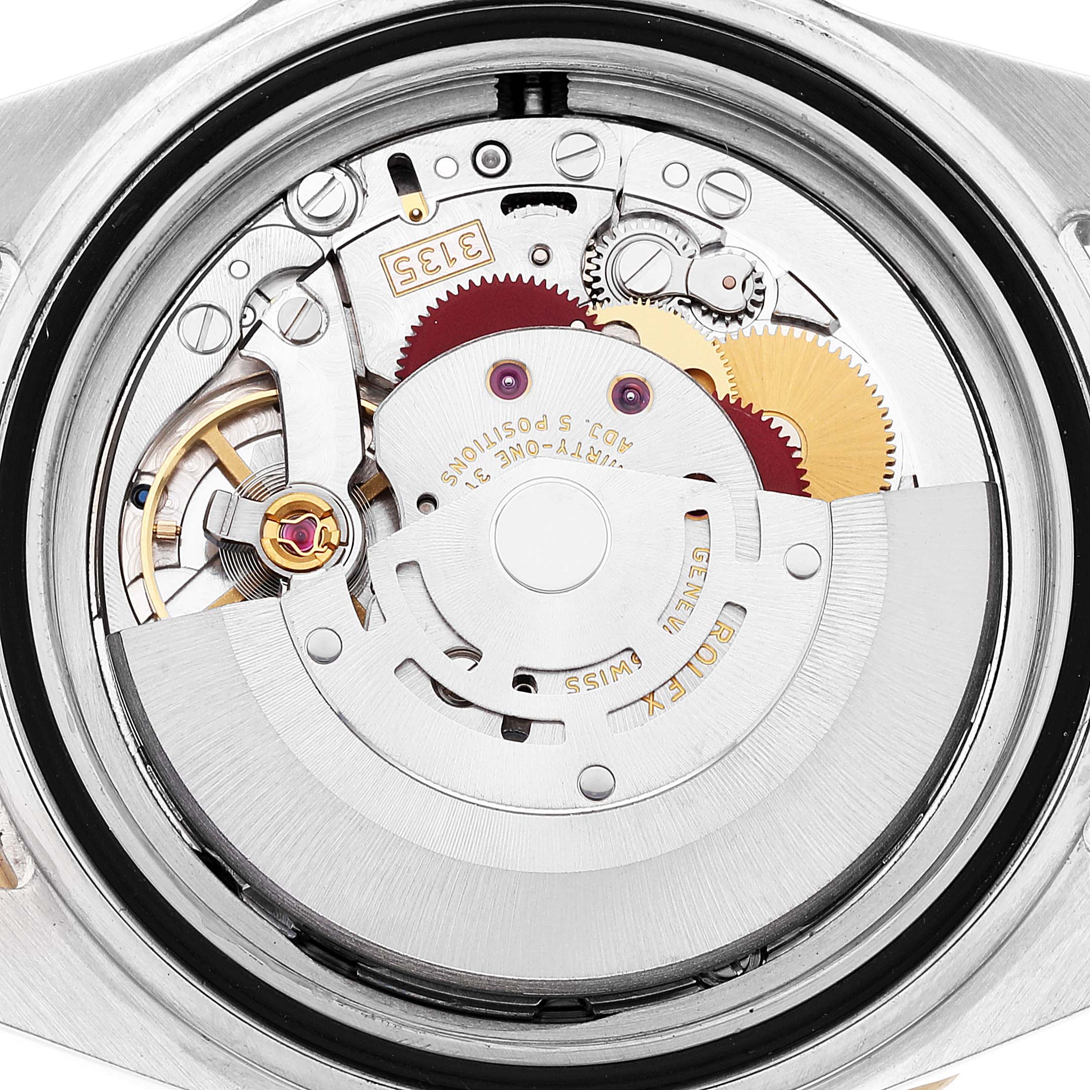 The image shows the internal mechanism of the Rolex Submariner 16613 Men
s Steel and Gold (two tone) Blue Dial 16613 Men
s Steel and Gold (two tone) Blue Dial watch taken from a top-down angle.