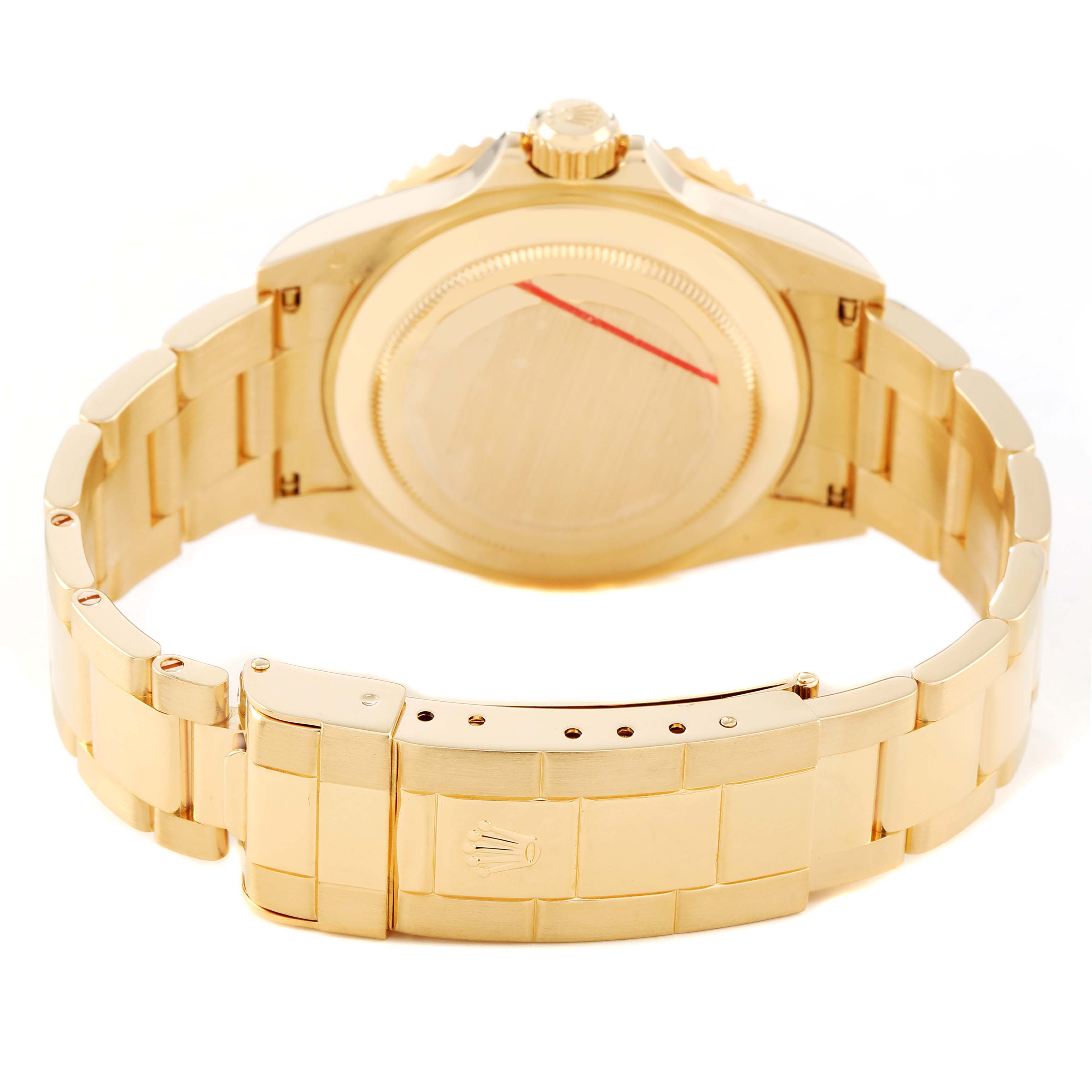 The image shows the back of the Rolex Submariner 16618 Men's Yellow Gold Blue Dial, highlighting the case back, crown, and clasp of the bracelet.