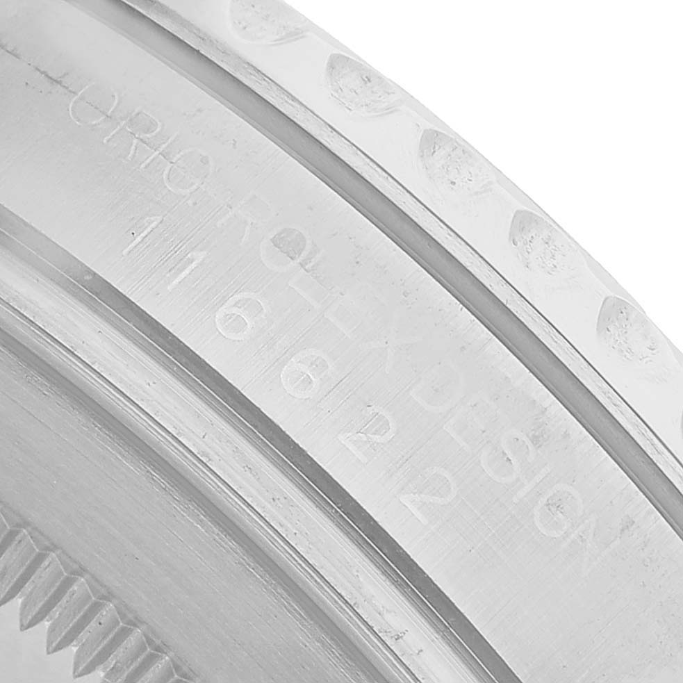 The image shows a close-up of the side engraving on a Rolex Yacht-Master 116622 Men's Stainless Steel Blue Dial bezel, highlighting its detailed finish.