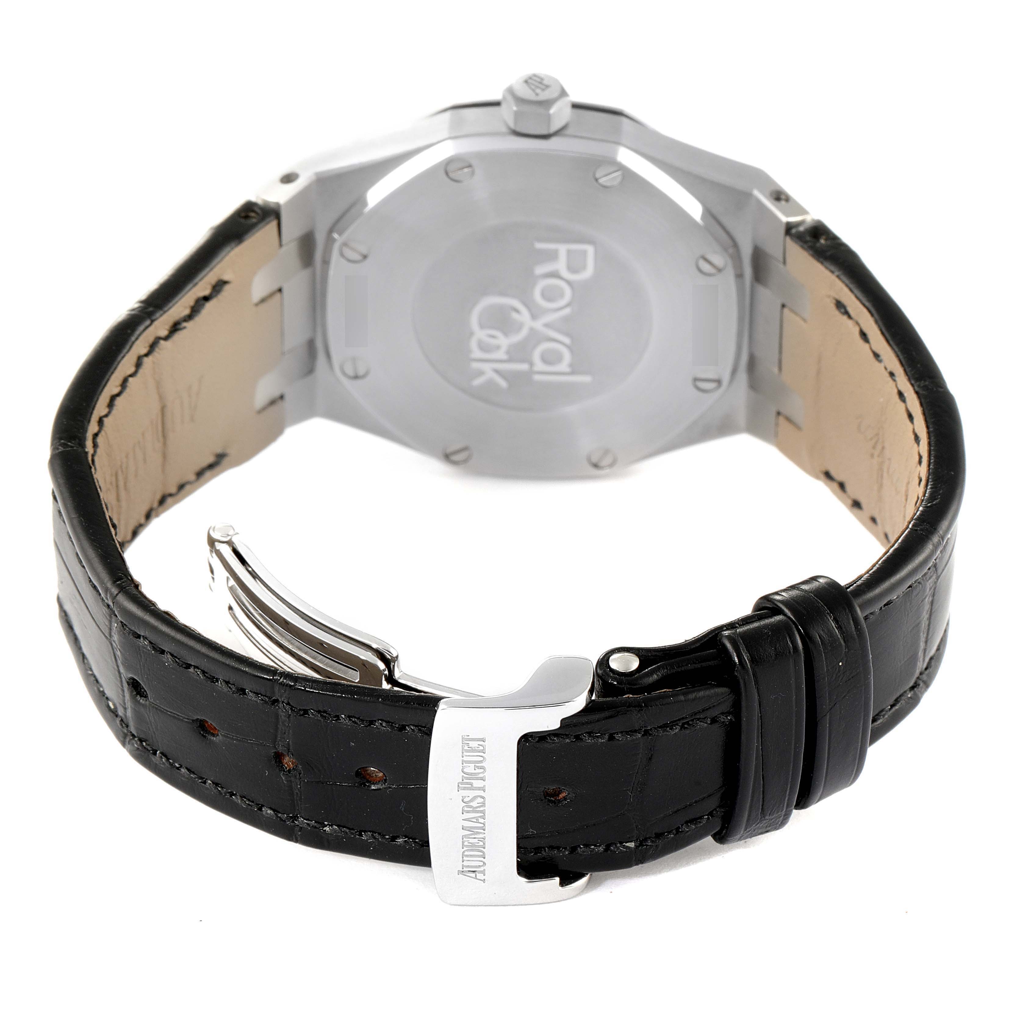 The image shows the back view of an Audemars Piguet Royal Oak 67651ST.ZZ.D002CR.01 Women's Stainless Steel Black Dial 67651ST.ZZ.D002CR.01 Women's Stainless Steel Black Dial watch, highlighting its case back and leather strap.