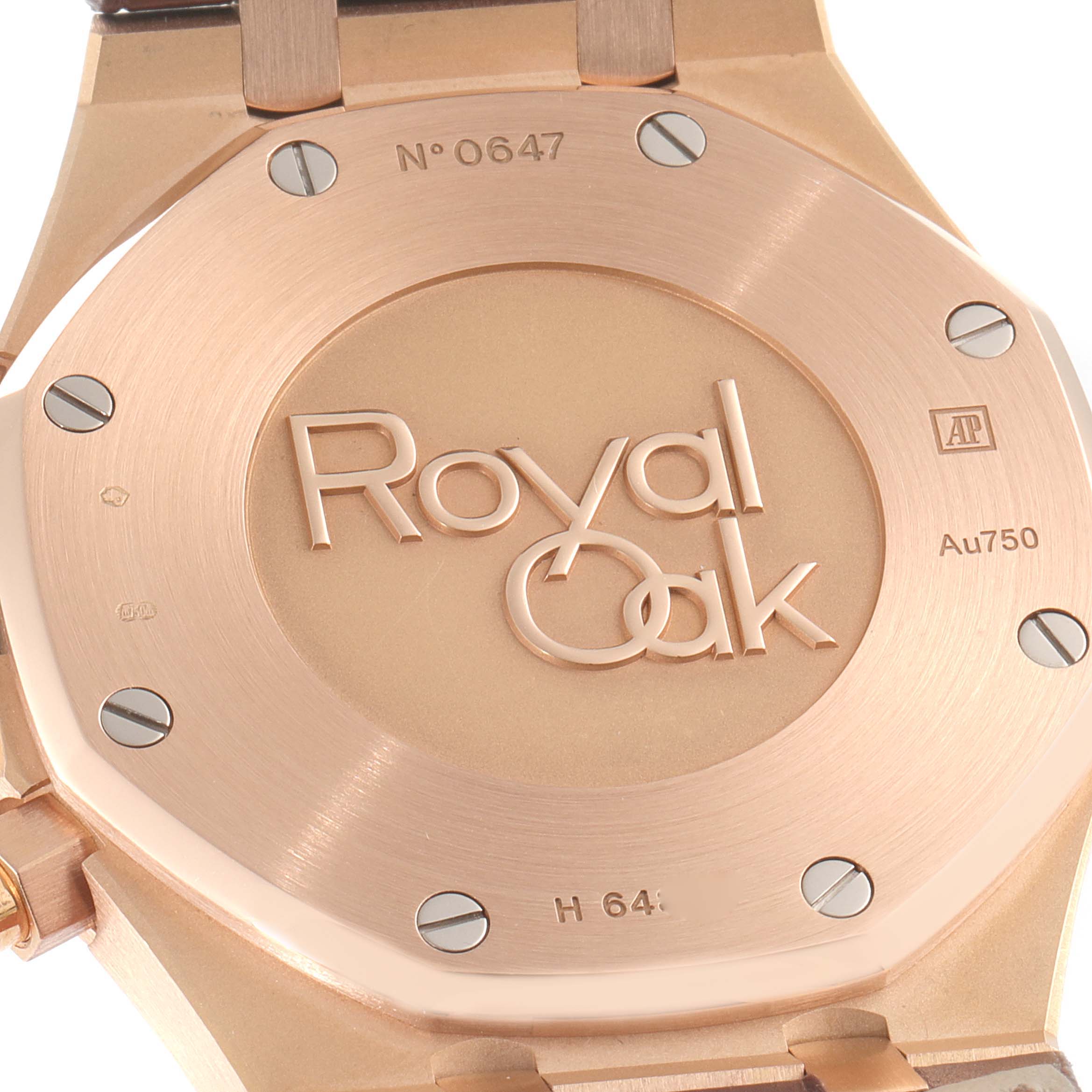 This image shows the back case of a Royal Oak model watch by Audemars Piguet, featuring the logo and serial number.