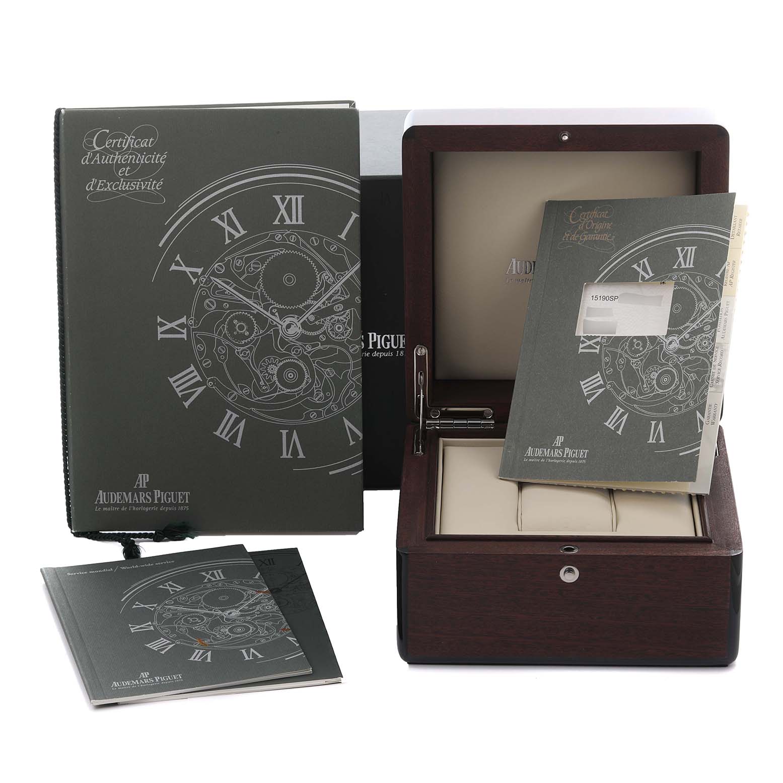 The image shows the packaging and accessories for the Royal Oak by Audemars Piguet, including the watch box and certificates.