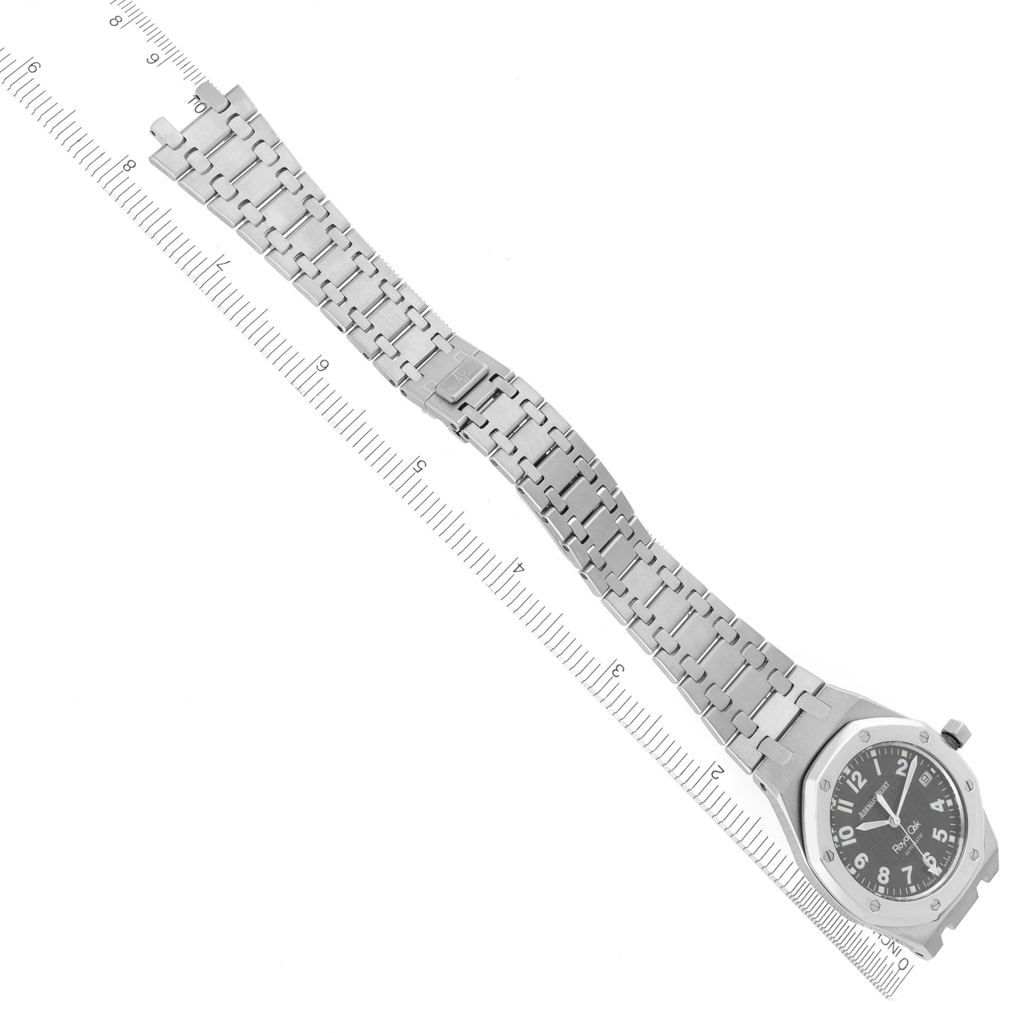 The image shows a Royal Oak by Audemars Piguet from an overhead angle, highlighting the watch face and entire metal bracelet.