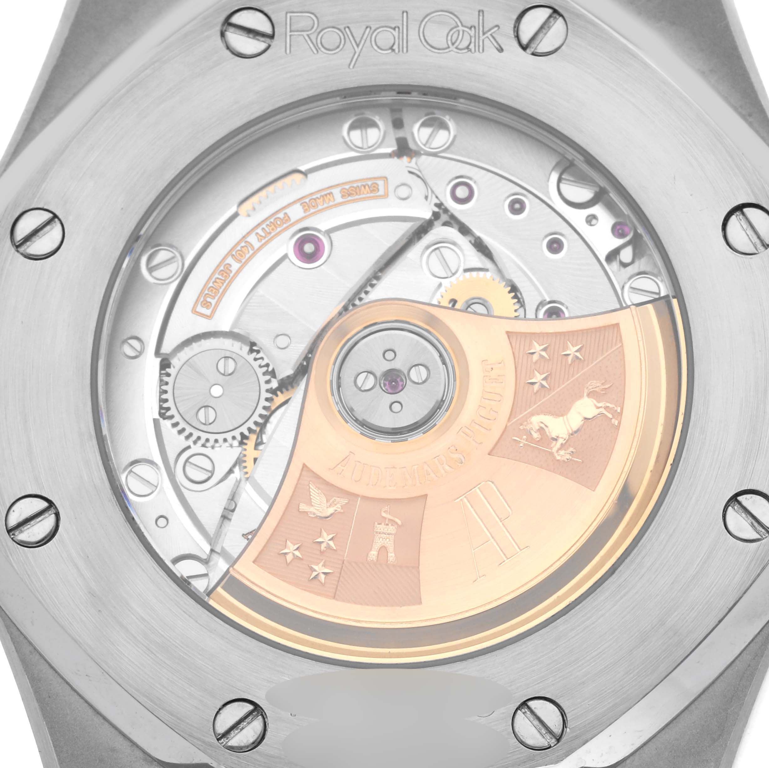 The image shows a close-up of the case back for the Audemars Piguet Royal Oak 15300ST.OO.1220ST.01 Men's Stainless Steel White Dial 15300ST.OO.1220ST.01 Men's Stainless Steel White Dial, revealing the movement and rotor.