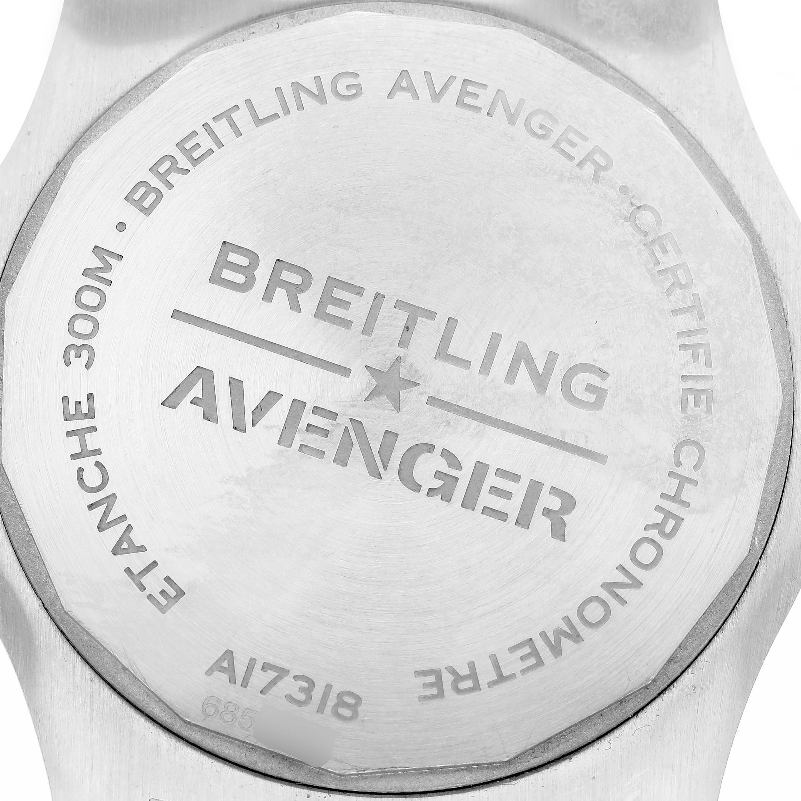 The image shows the case back of a Breitling Avenger A17318 Men's Stainless Steel Black Dial, highlighting its engravings and model information.