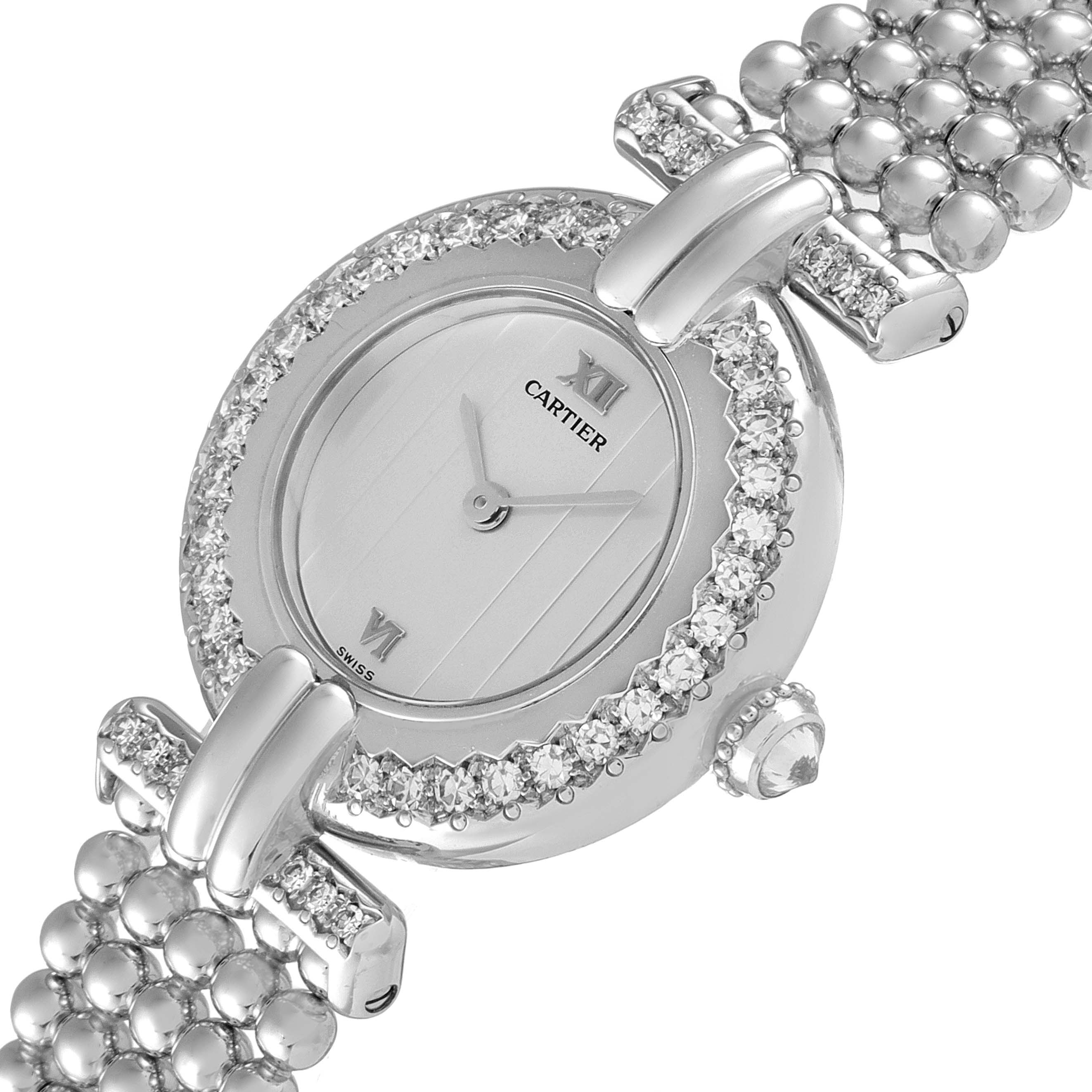 The image shows a close-up of the dial and bracelet of the Cartier Colisee 1981 Women's White Gold Silver Dial 1981 Women's White Gold Silver Dial watch, highlighting its diamond-studded bezel.
