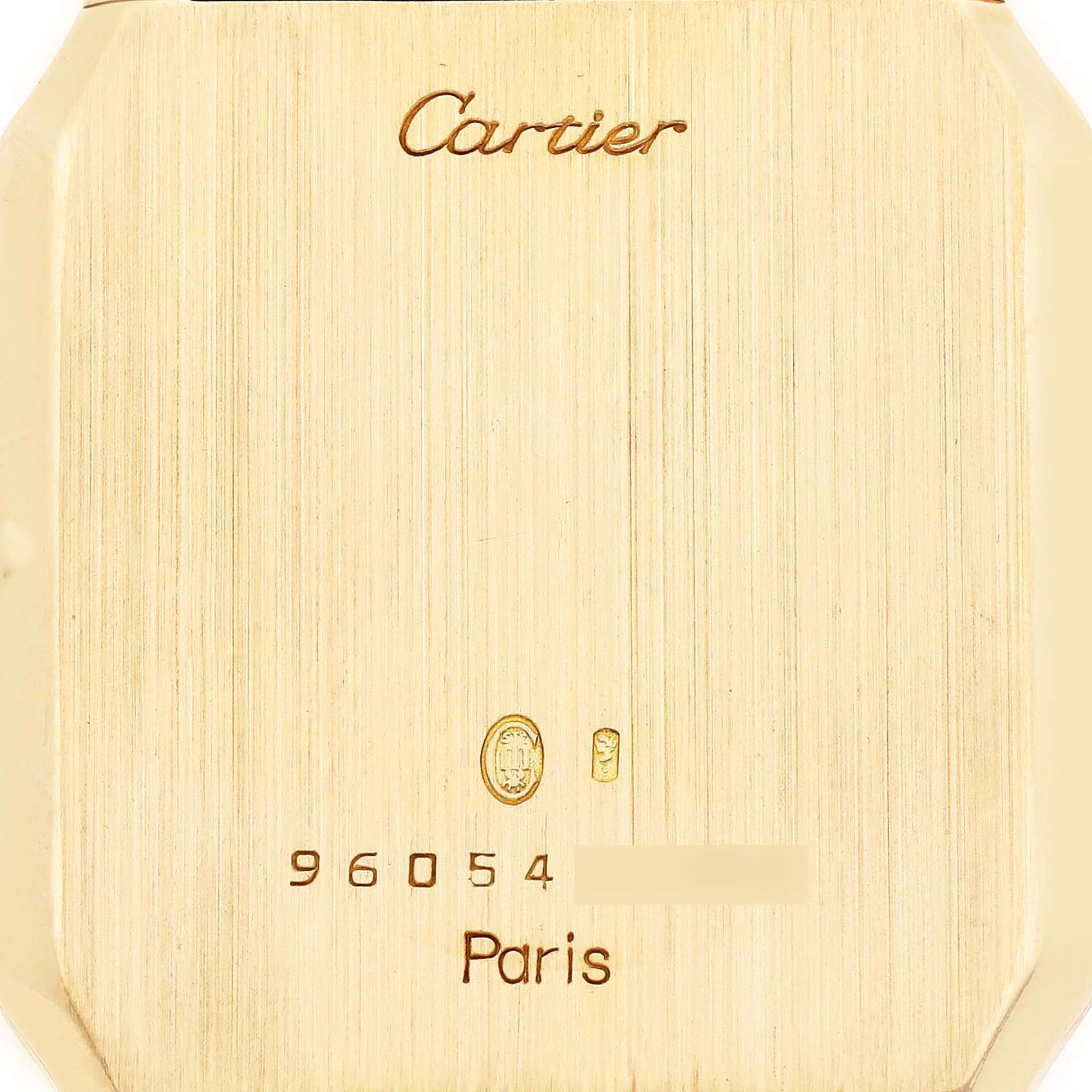 The image shows the back case of a Cartier Santos Dumont W1505453 Men's Yellow Gold White Dial watch with the brand and model details engraved.