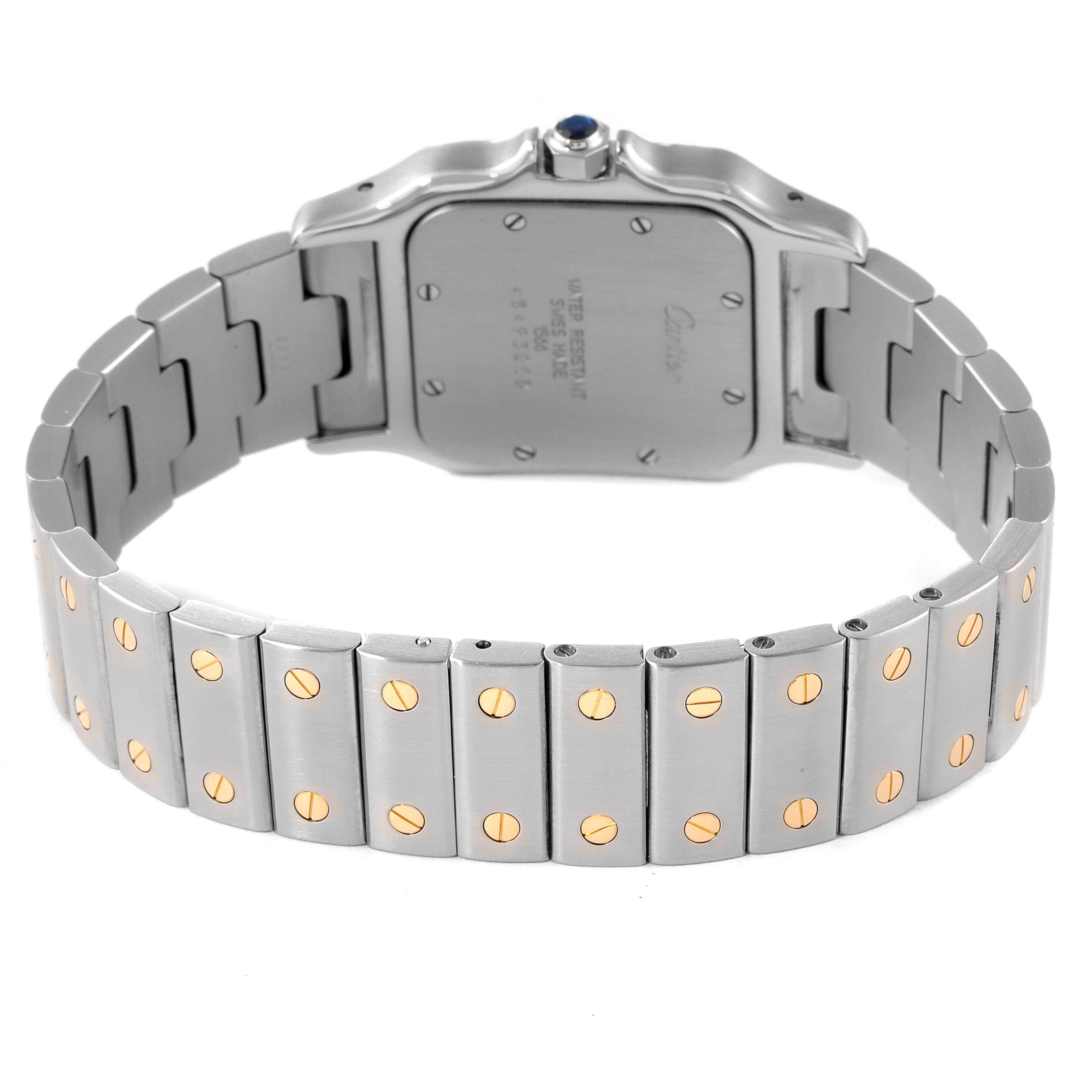 The image shows the back view of a Santos model watch by Cartier, highlighting its metal bracelet and case back.