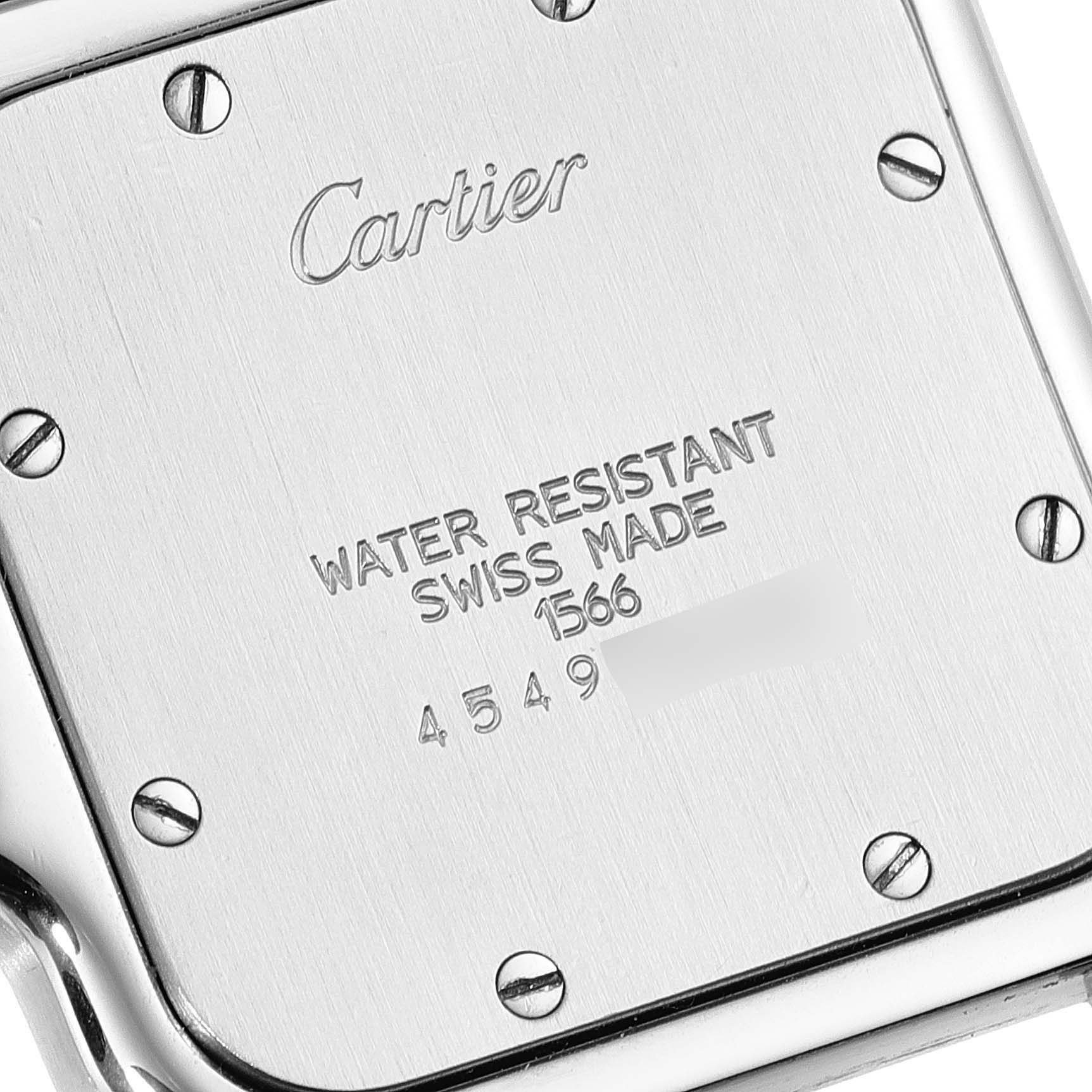 The image shows the back case of a Cartier Santos W20011C4 Men
s Steel and Gold (two tone) Silver Dial W20011C4 Men
s Steel and Gold (two tone) Silver Dial watch, highlighting the engraved brand name and details about water resistance and origin.