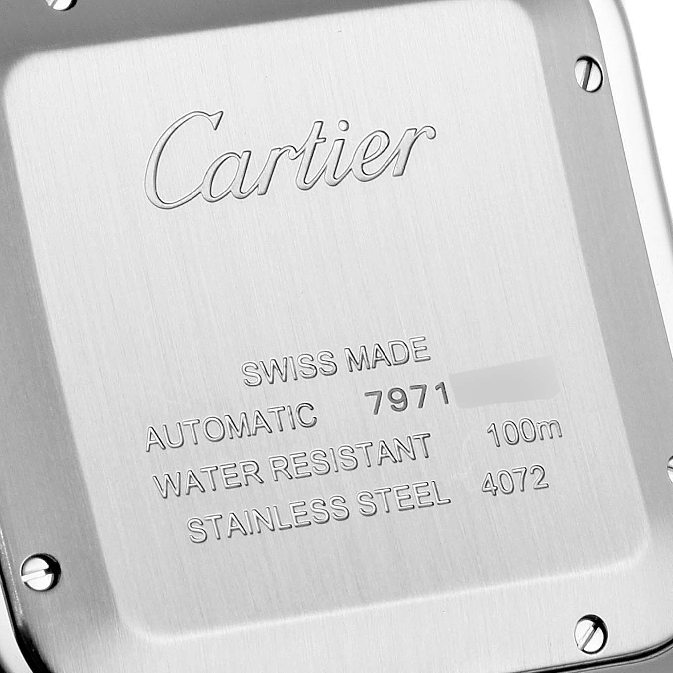 The image shows the back case of a Santos model by Cartier, highlighting its engravings and specifications.