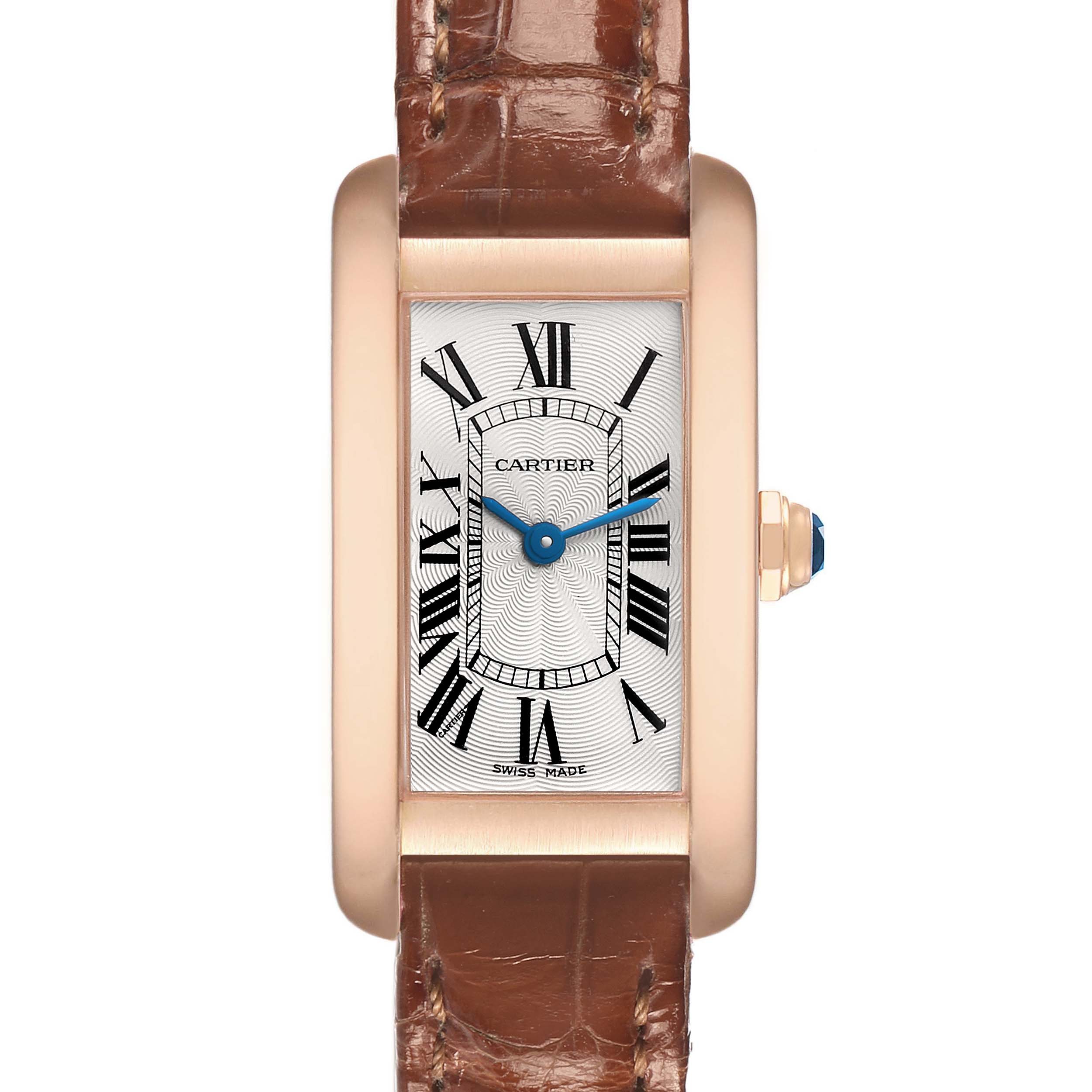 The Cartier Tank Américaine watch is shown from the front, displaying the face, Roman numerals, and leather strap.