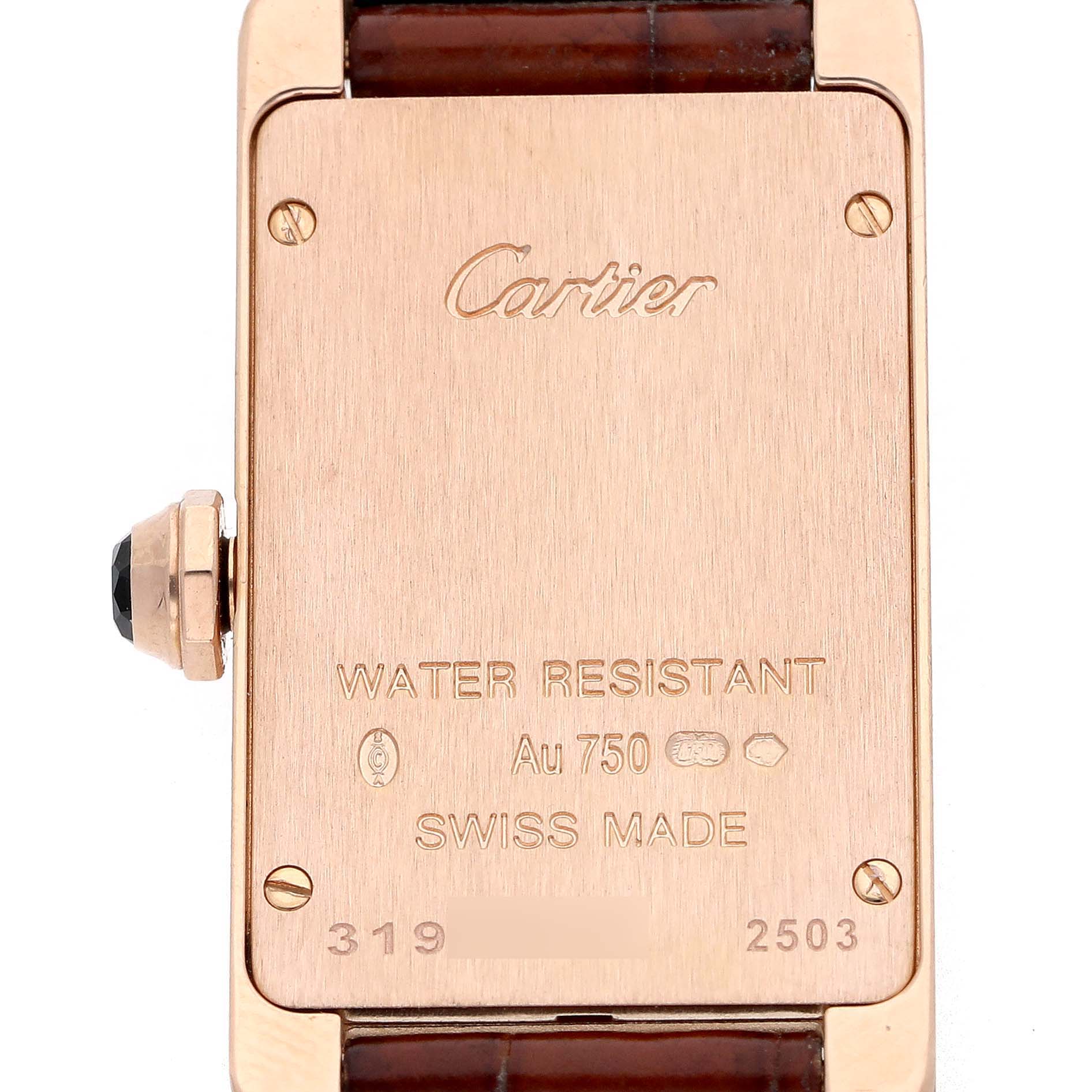 The image shows the back of a Cartier Tank Américaine watch, highlighting engravings and the crown.