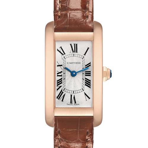 The Cartier Tank Américaine watch is shown from a front view, highlighting its rectangular dial, Roman numerals, and brown leather strap.