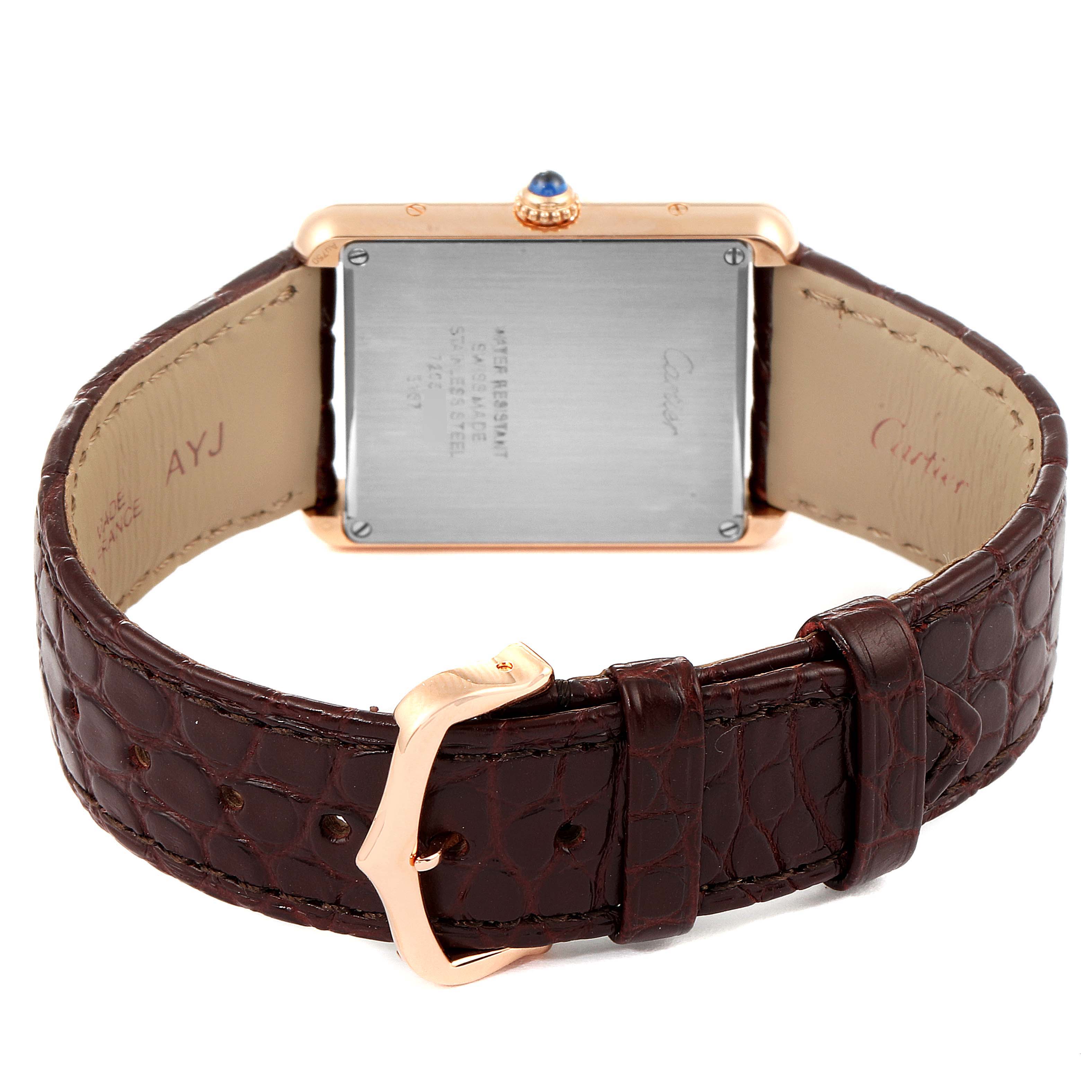 The image shows the back of a Cartier Tank Solo W5200025 Men's Rose Gold Silver Dial W5200025 Men's Rose Gold Silver Dial watch with a brown leather strap and a gold buckle.