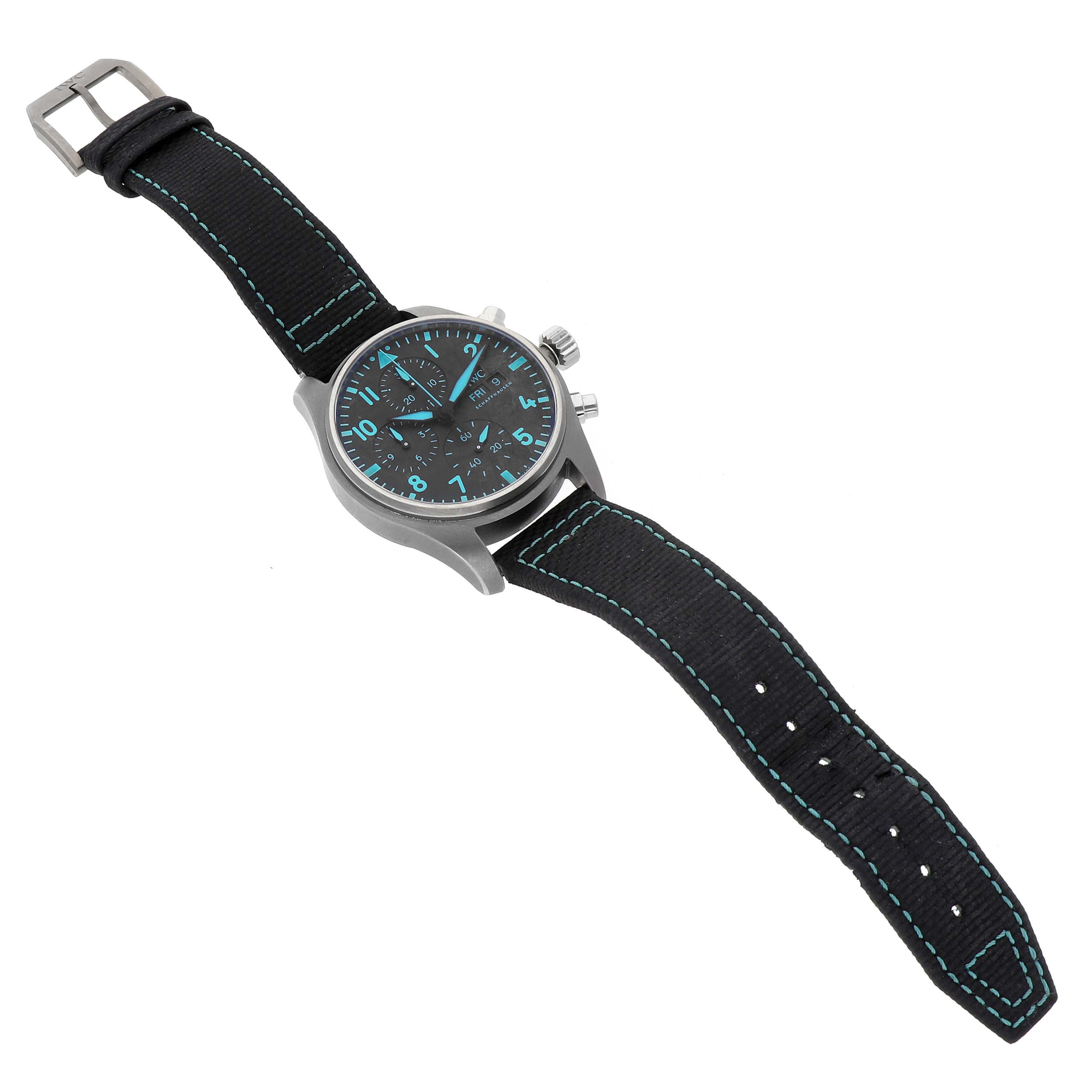 The IWC Pilot IW388114 Men's Titanium Black Dial watch is shown at a slight angle emphasizing the face, bezel, crown, and strap.