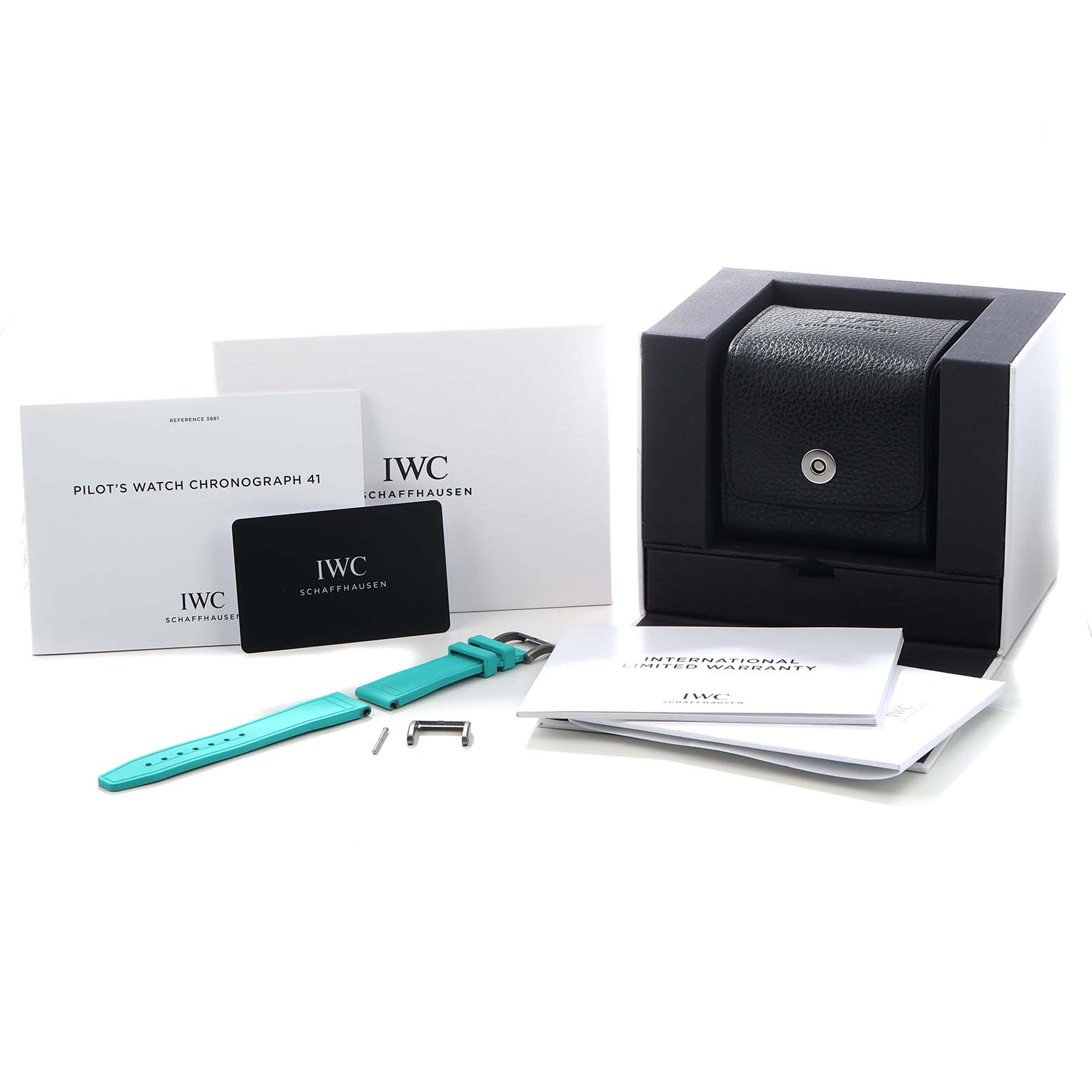 The image shows the IWC Pilot IW388114 Men's Titanium Black Dial's Watch Chronograph 41 packaging, including a box, manuals, warranty card, strap, and tools.