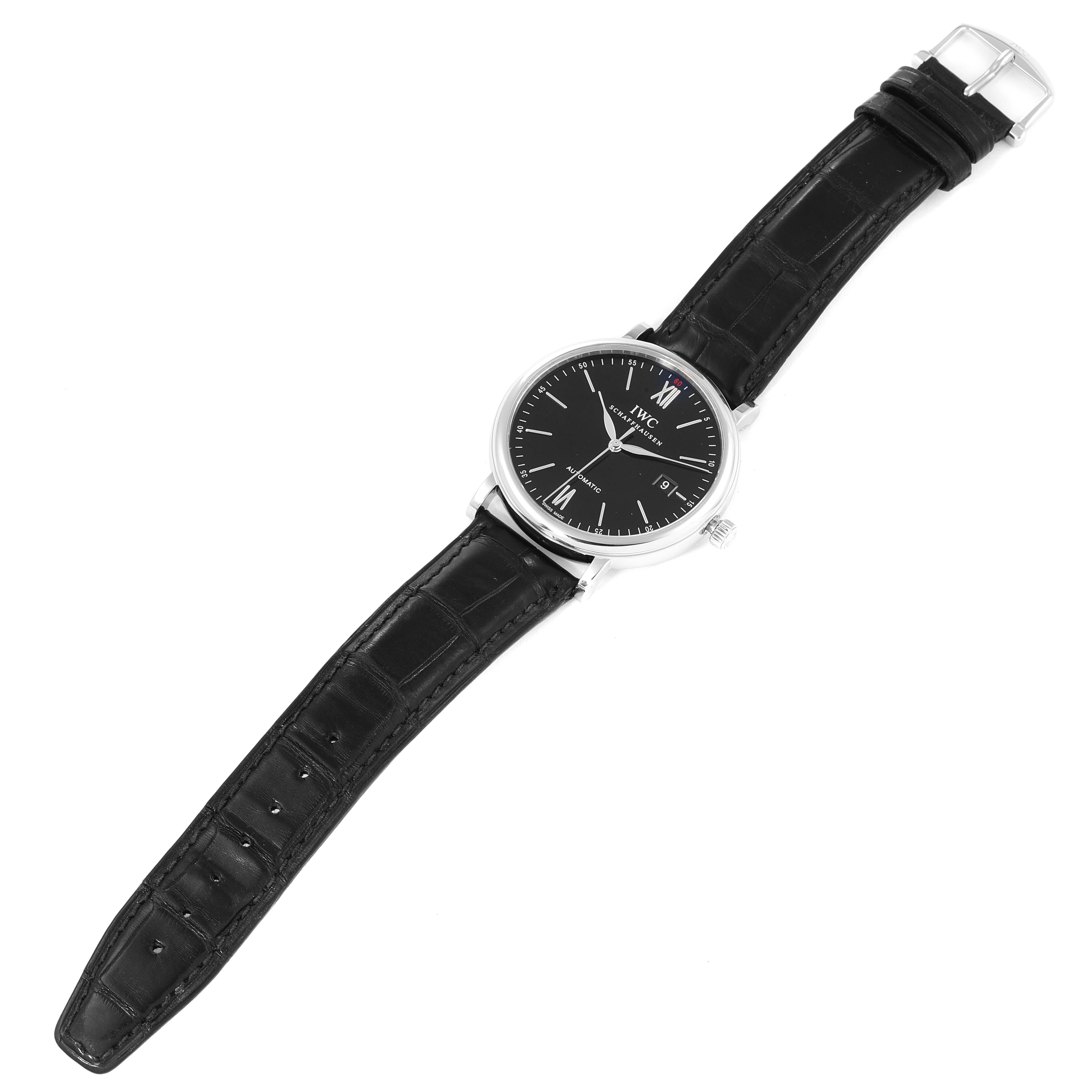 The image shows an IWC Portofino IW356502 Men's Stainless Steel Black Dial IW356502 Men's Stainless Steel Black Dial watch laid flat, displaying the face, case, and black leather strap from a top-down angle.