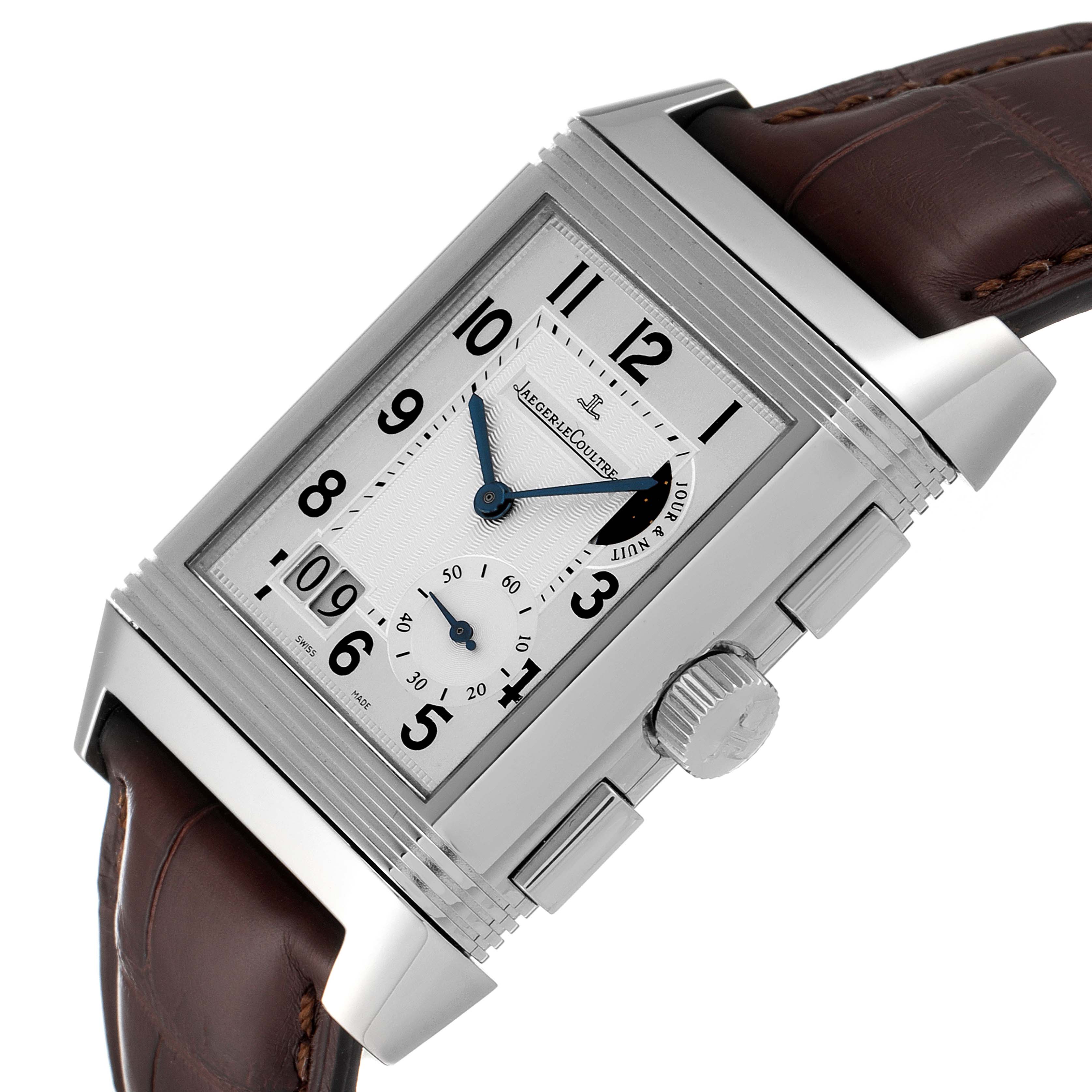 The image shows a Jaeger LeCoultre Reverso Q3028420 Men
s Stainless Steel Silver Dial Q3028420 Men
s Stainless Steel Silver Dial watch at an oblique angle, highlighting the dial, crown, and part of the strap.